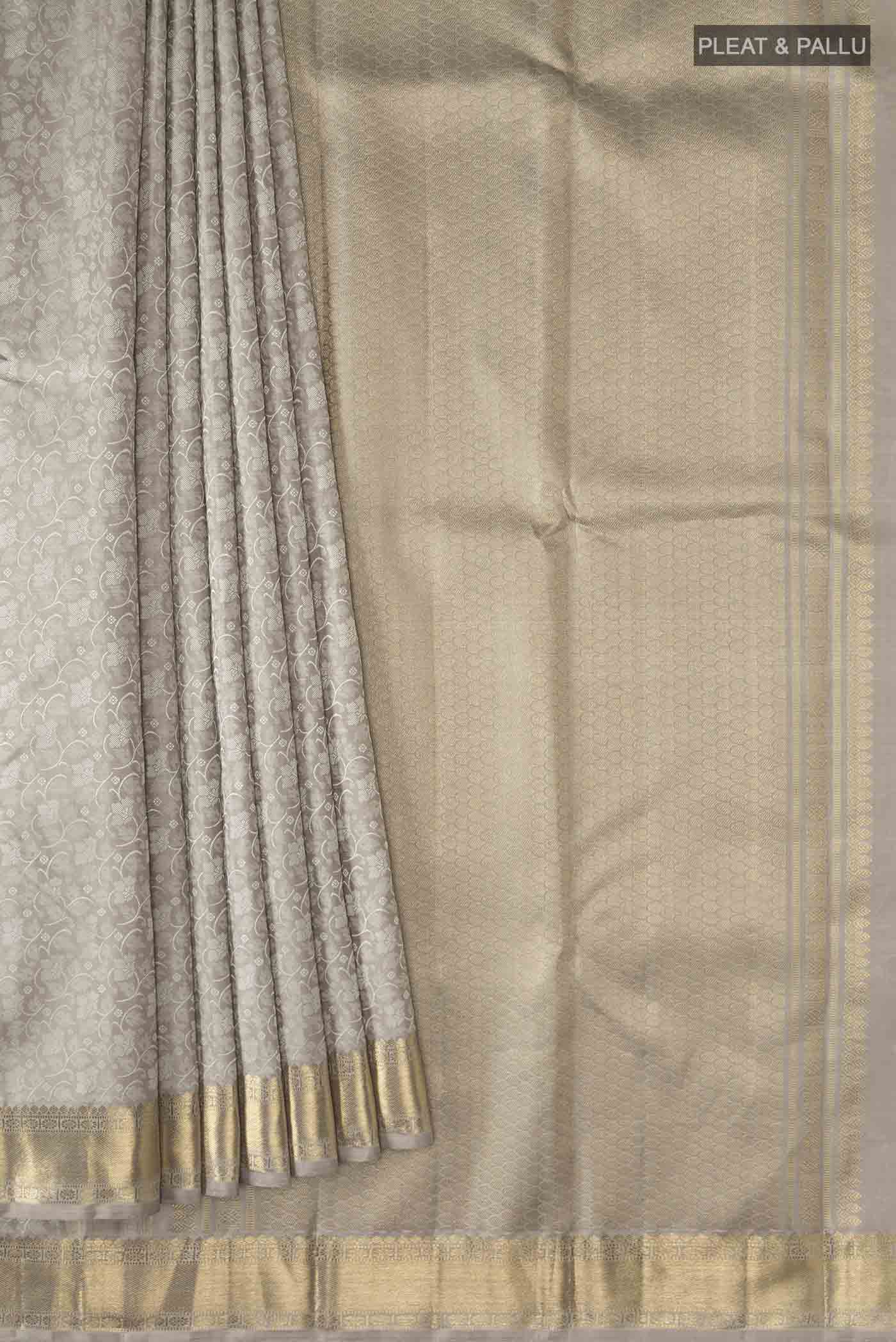 Pleats and pallu of Grey Kanchipuram Silk Saree with Jacquard design on the body and Zari Border