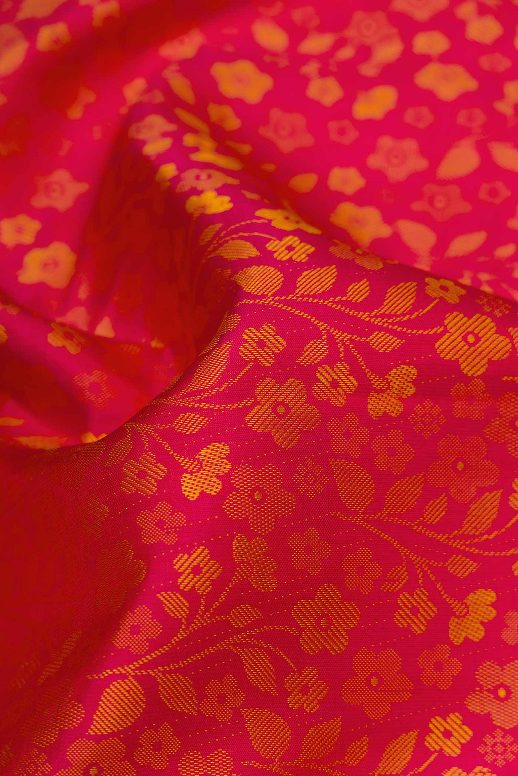 Close up of Pure Silk Pure Zari Pink Dual Tone Kanjivaram Saree with Jacquard design on the body and Zari Border.  displaying folds