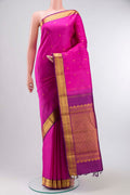 Pink Kanchipuram Silk Saree with Zari Butta on the body and Zari Border displayed on a mannequin