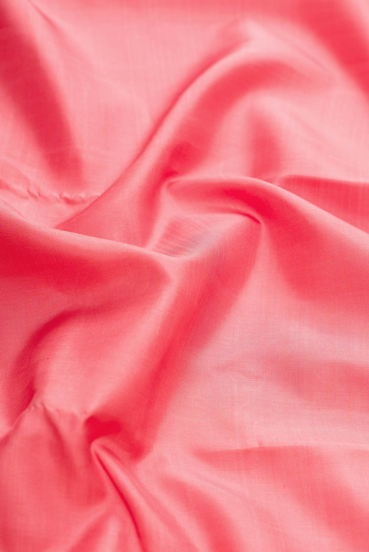 Close up of Pink Dual Tone Kanchipuram Silk Saree with Plain Body and Zari Border displaying folds