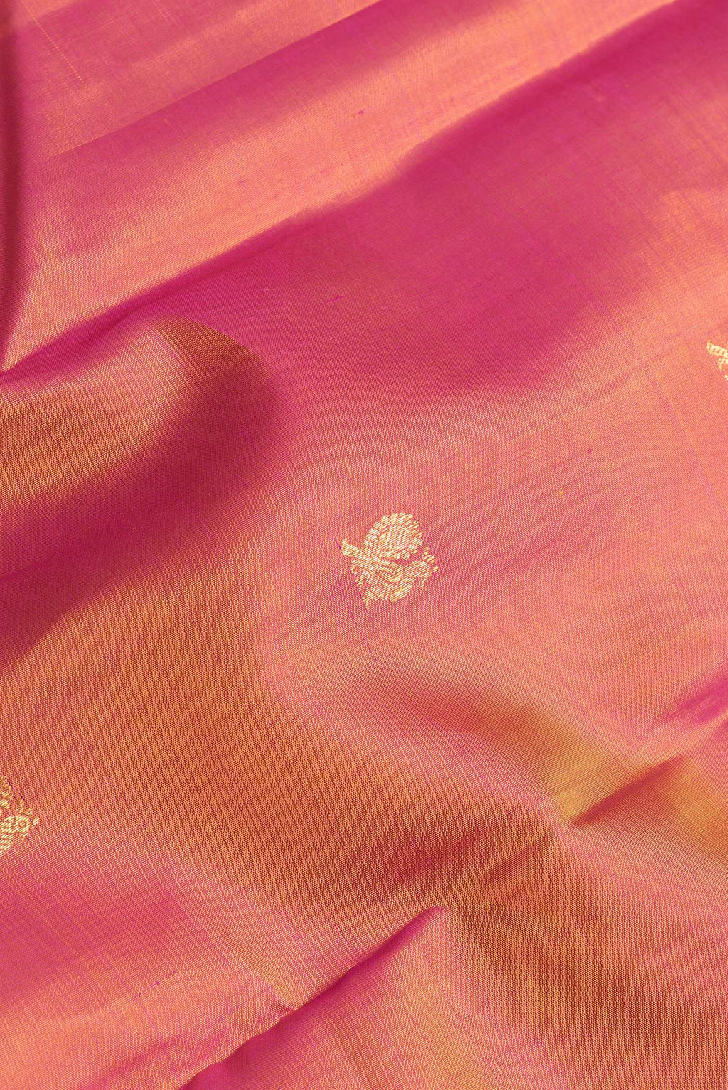 Close up of Mustard Dual Tone Kanchipuram Silk Saree with Zari Butta on the body and Zari Border.  displaying folds
