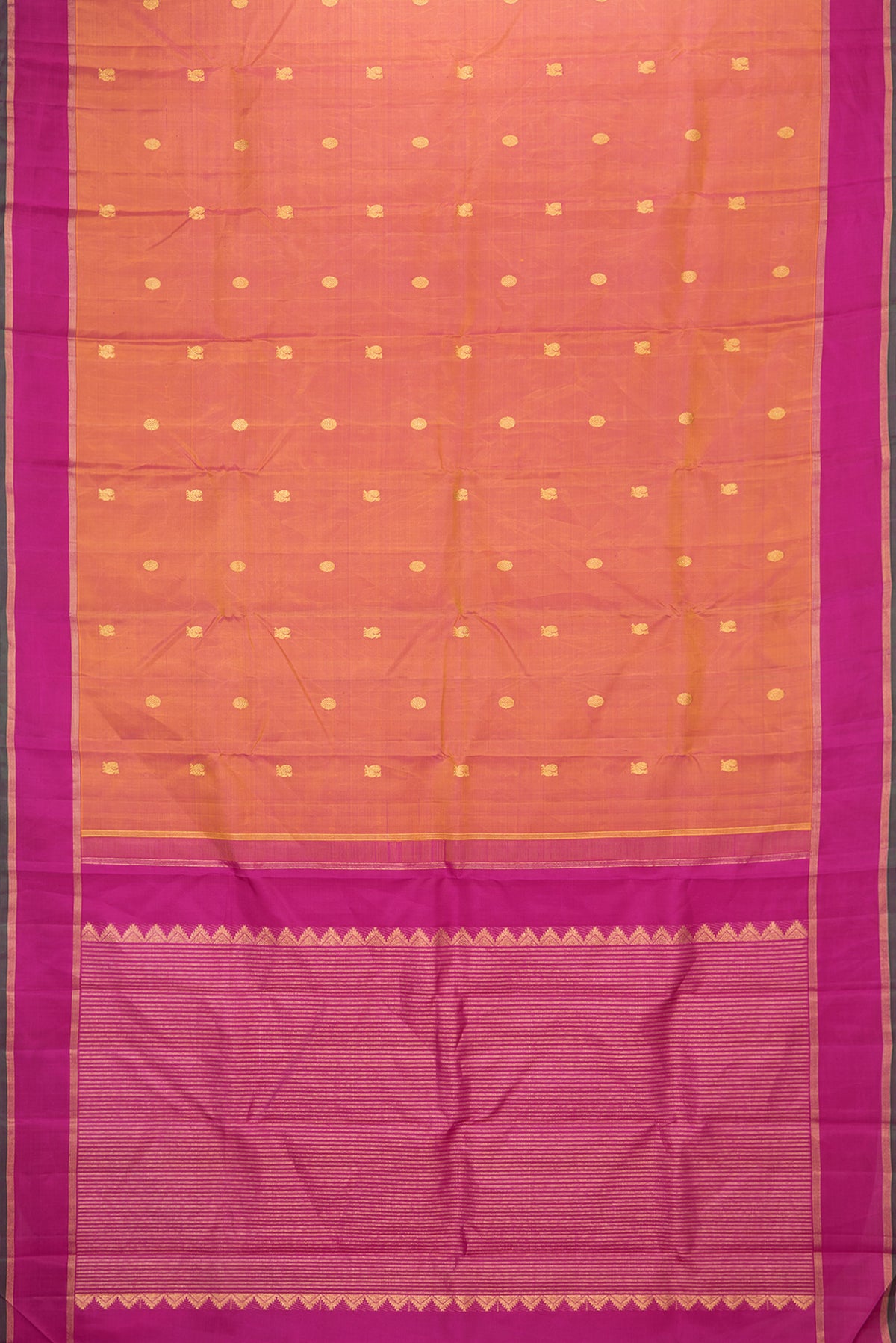Flat view of Mustard Dual Tone Kanchipuram Silk Saree with Zari Butta on the body and Zari Border. 