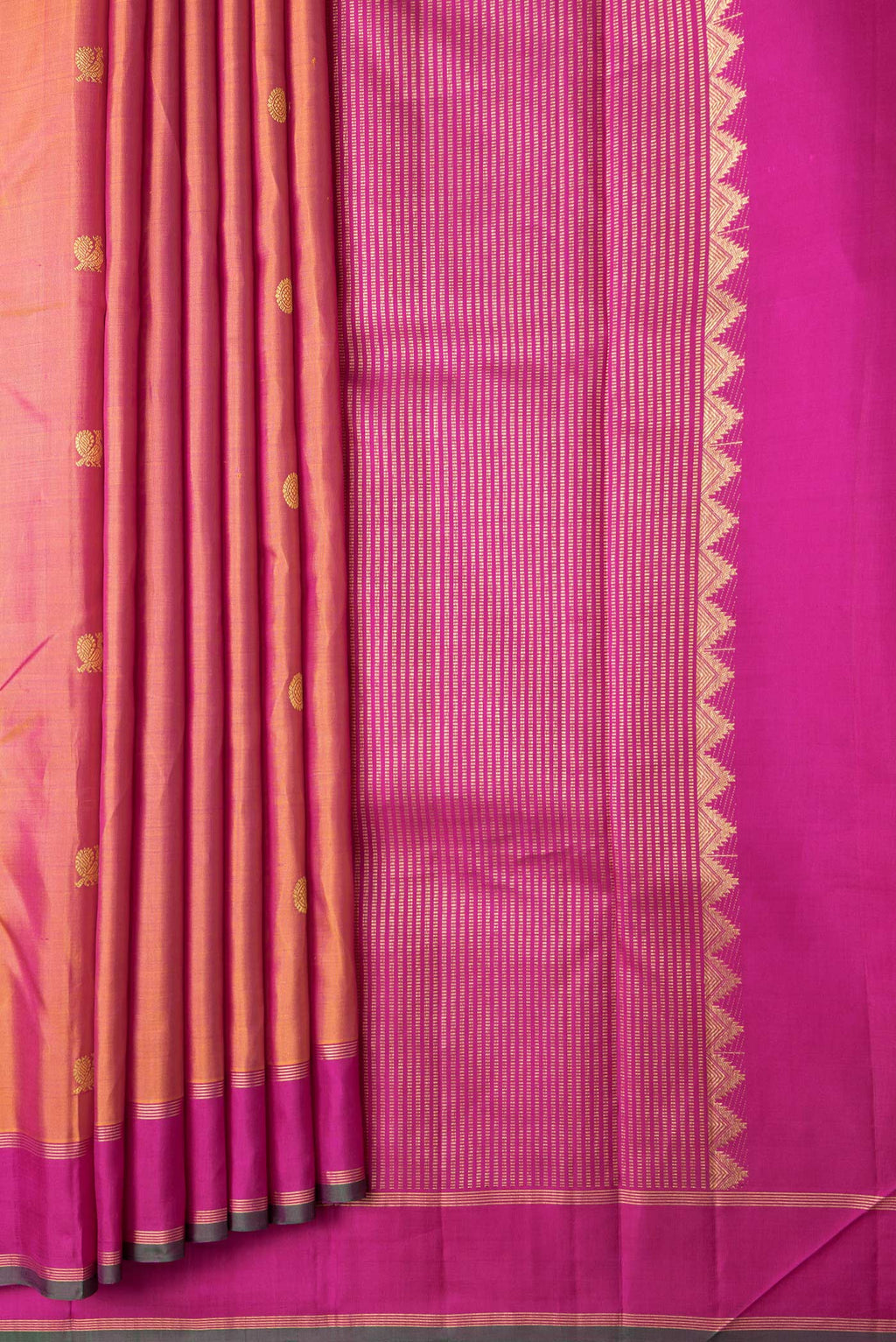 Pleats and pallu of Mustard Dual Tone Kanchipuram Silk Saree with Zari Butta on the body and Zari Border. 