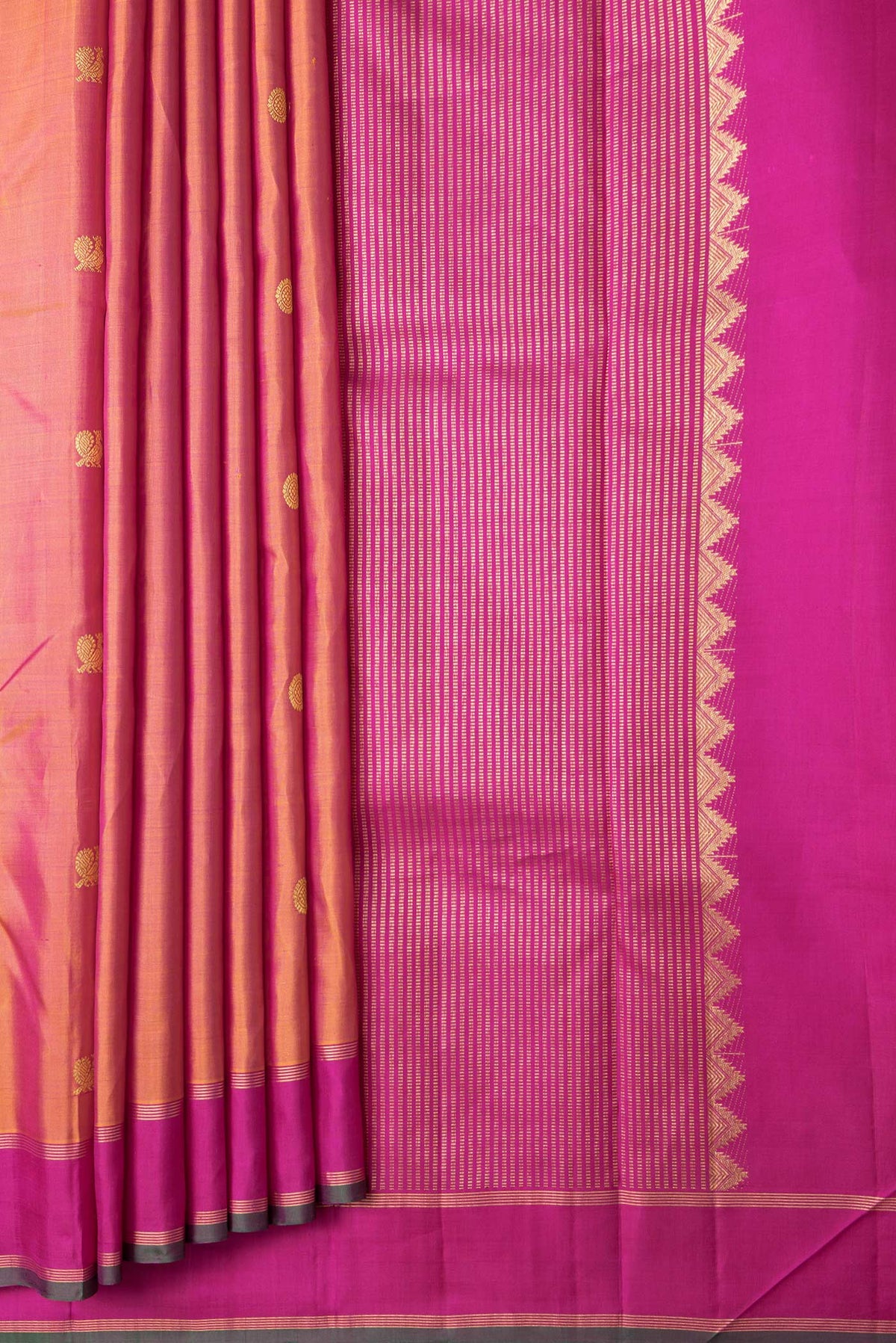 Pleats and pallu of Mustard Dual Tone Kanchipuram Silk Saree with Zari Butta on the body and Zari Border. 
