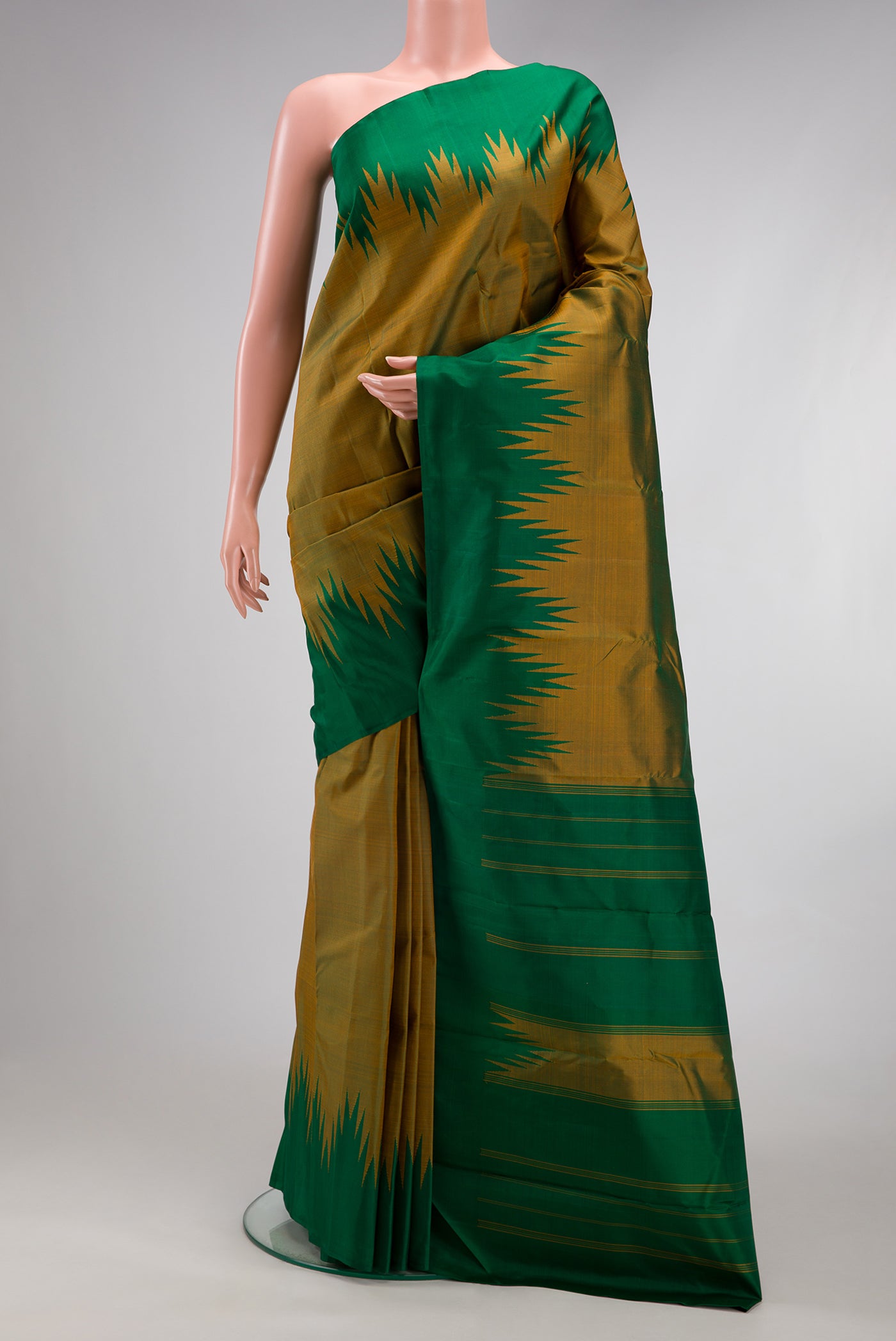 Mehandi Green Kanchipuram Silk Saree with Plain Body and Temple Border.  displayed on a mannequin