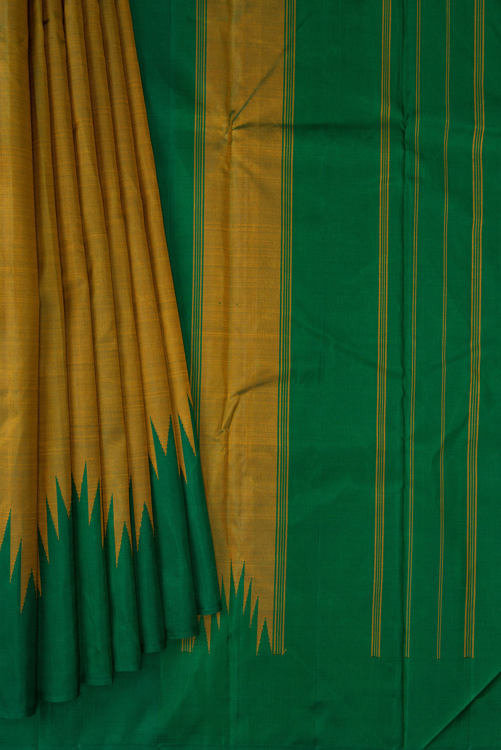 Pleats and pallu of Mehandi Green Kanchipuram Silk Saree with Plain Body and Temple Border. 