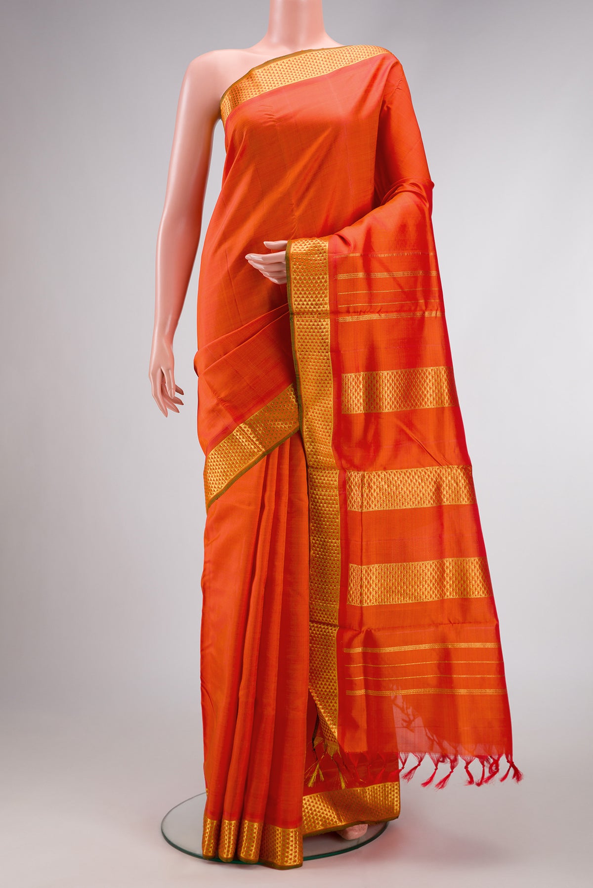 Pure Silk Pure Zari Orange Dual Tone Kanjivaram Nine Yards Saree with Plain Body and Zari Border.  displayed on a mannequin