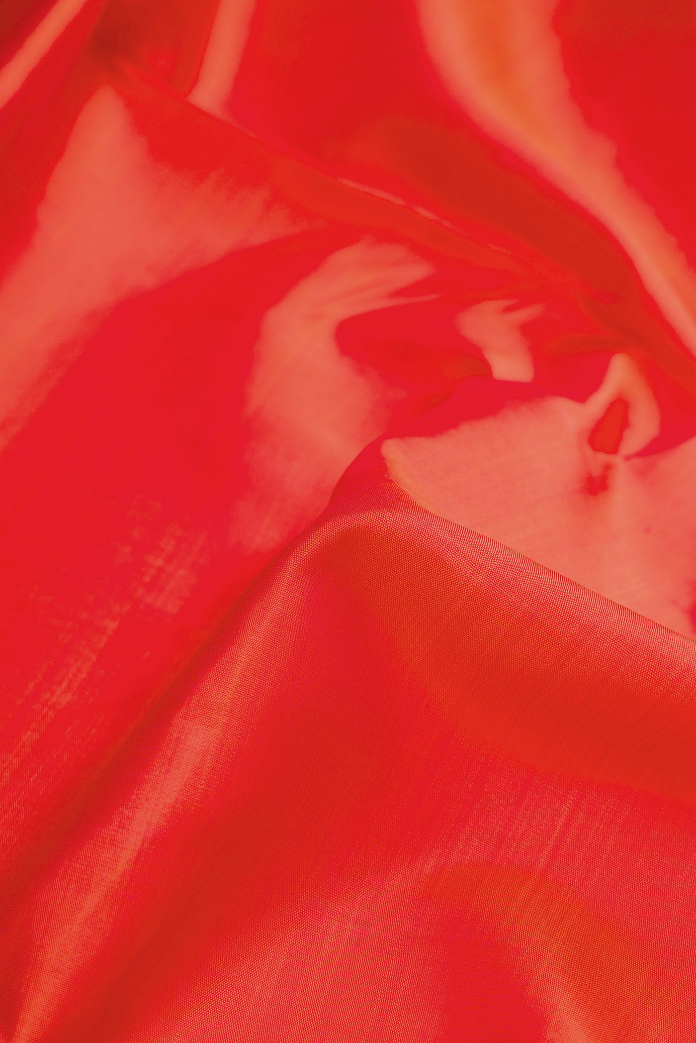 Close up of Pure Silk Pure Zari Orange Dual Tone Kanjivaram Nine Yards Saree with Plain Body and Zari Border.  displaying folds