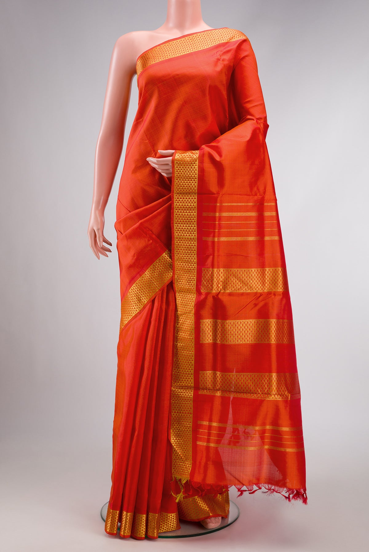 Pure Silk Pure Zari Orange Dual Tone Kanjivaram Nine Yards Saree with Plain Body and Zari Border.  displayed on a mannequin