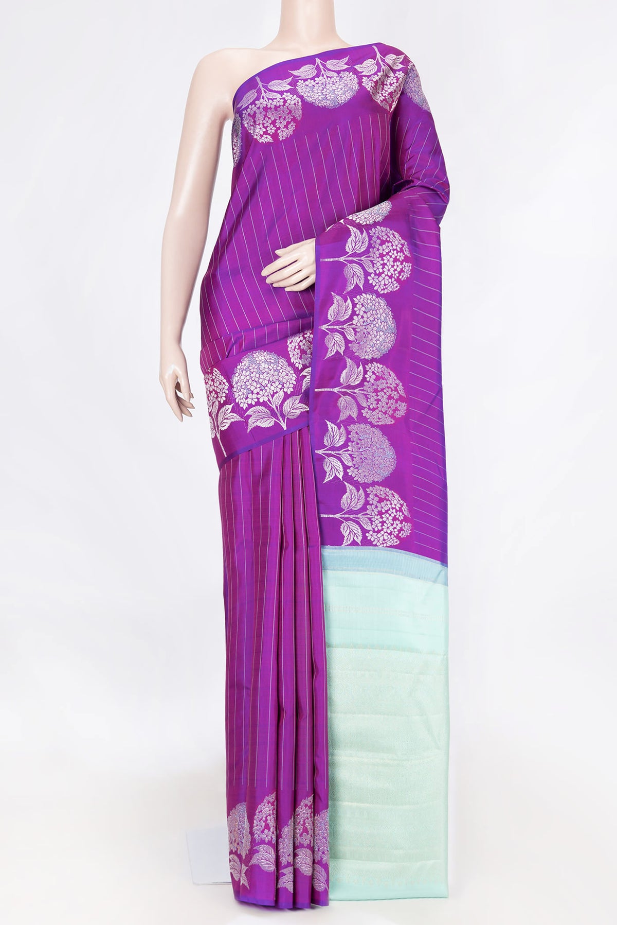 Purple Dual Tone Kanchipuram Saree with Stripes on the body and Fancy Border displayed on a mannequin