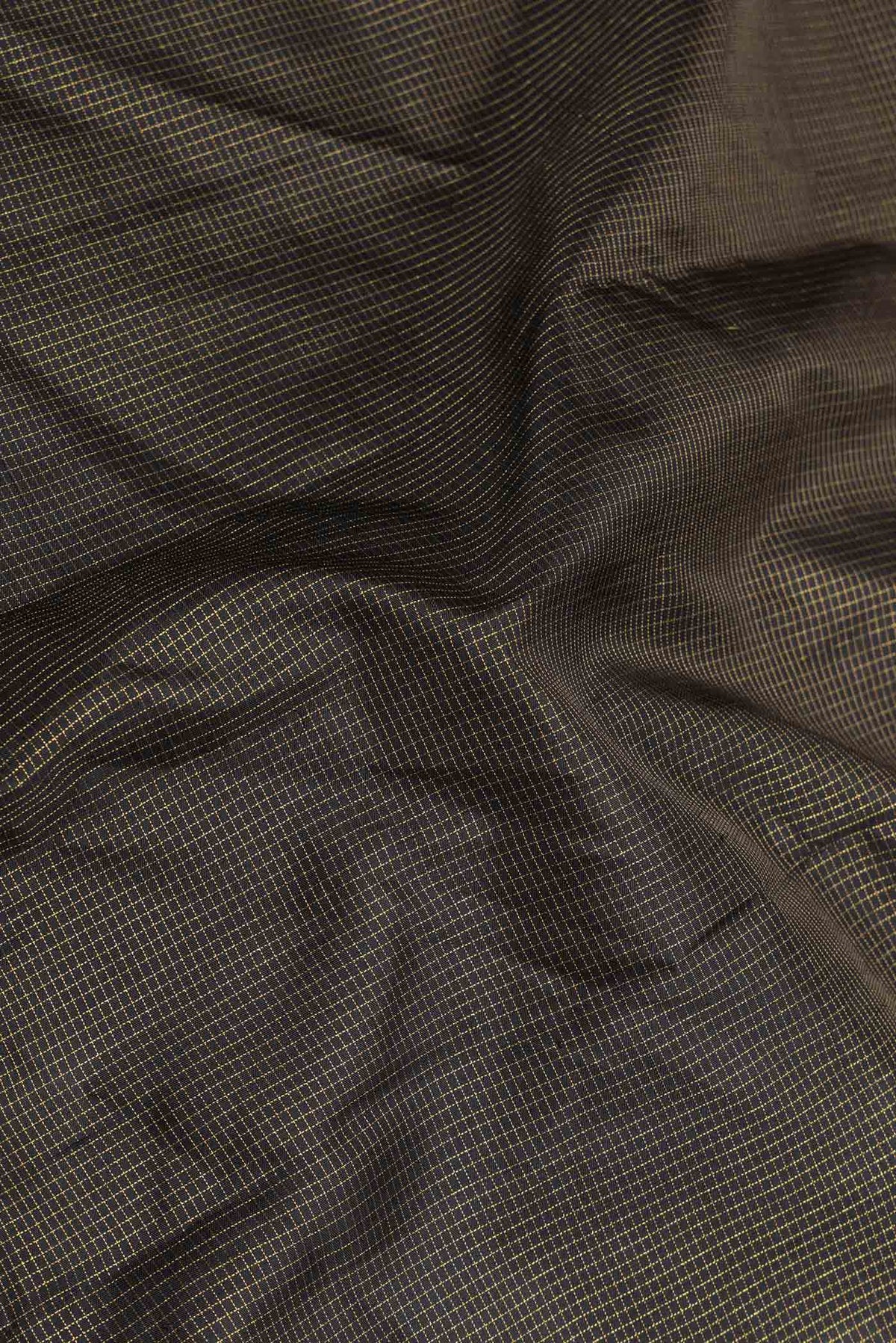 Close up of Black Dual Tone Kanchipuram Saree with Stripes on the body and Fancy Border displaying folds