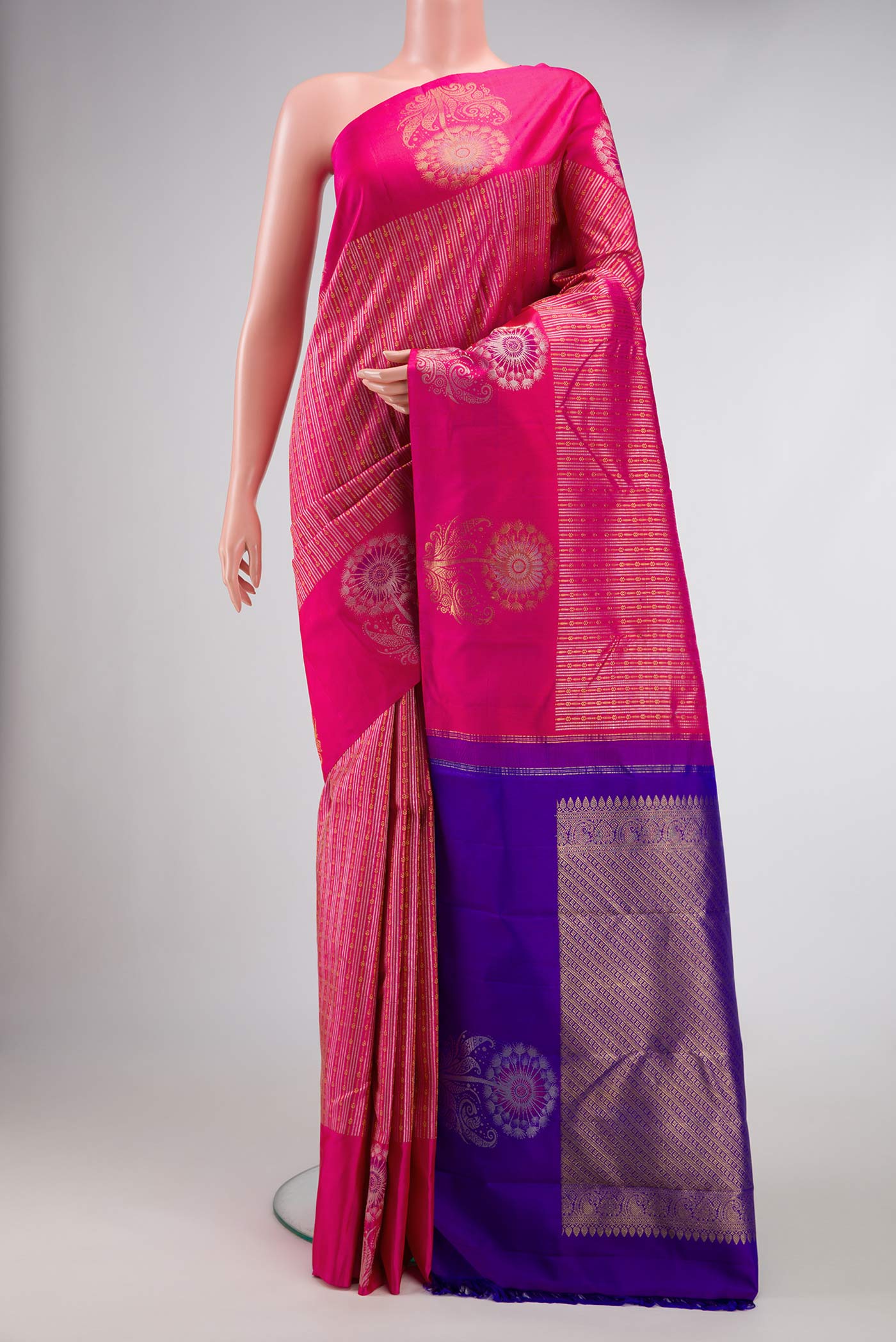 Pink Dual Tone Kanjivaram Silk Saree with Stripes on the body and Fancy Border.  displayed on a mannequin