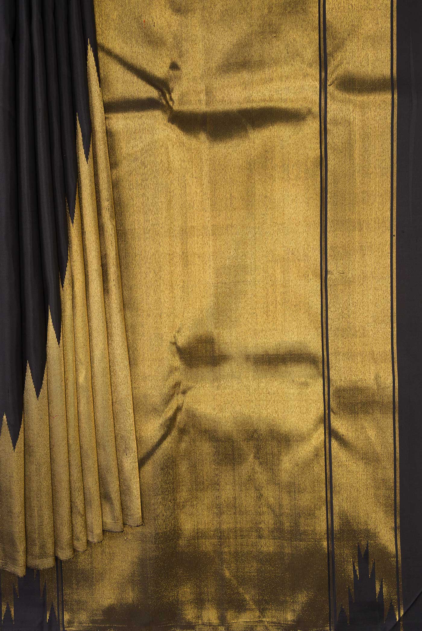 Pleats and pallu of Black Dual Tone Kanchipuram Silk Saree with Plain Body and Rising Temple Border. 