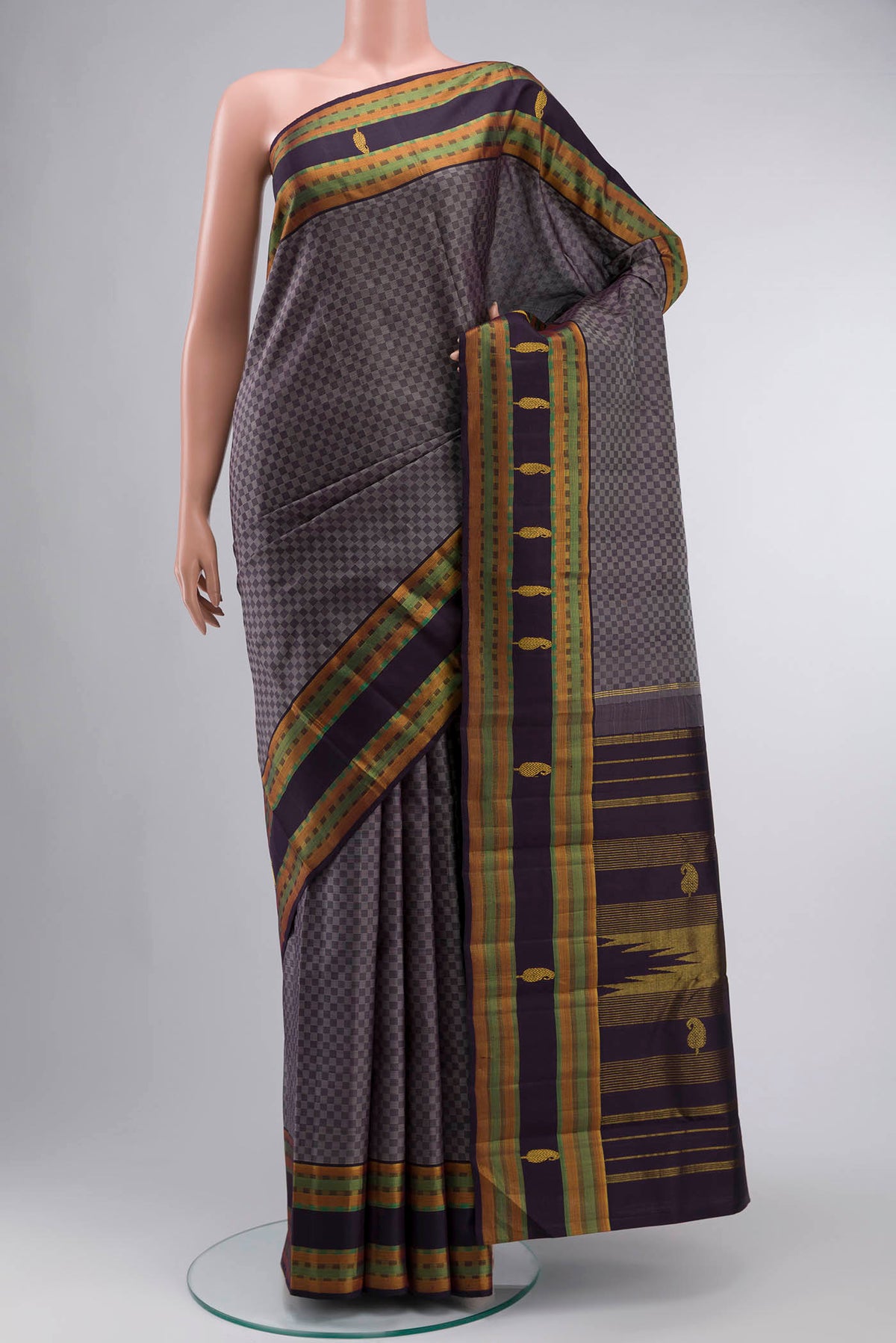 Grey Kanchipuram Silk Saree Checked design on the body and Zari Border displayed on a mannequin