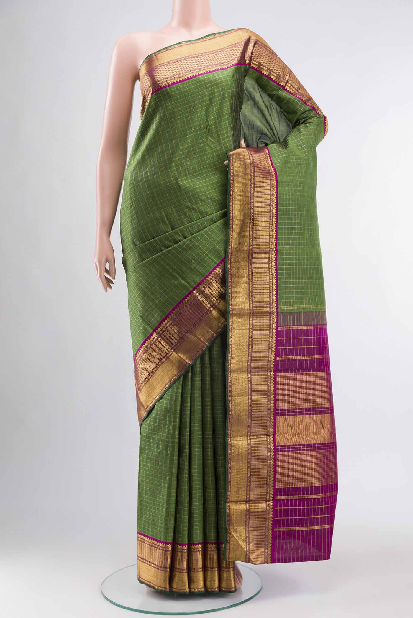 Green Kanchipuram Silk Saree with Checked design on the body and Zari Border displayed on a mannequin
