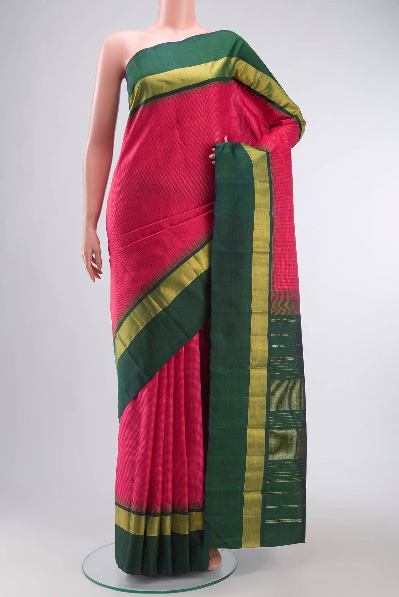 Pink Kanchipuram Silk Saree with Checked design on the body and Zari Border displayed on a mannequin
