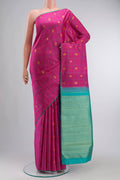 Pink Kanchipuram Silk Saree with Zari Butta on the body and Plain Border displayed on a mannequin