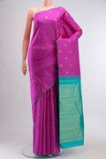 Pink Kanchipuram Silk Saree with Zari Butta on the body and Plain Border displayed on a mannequin