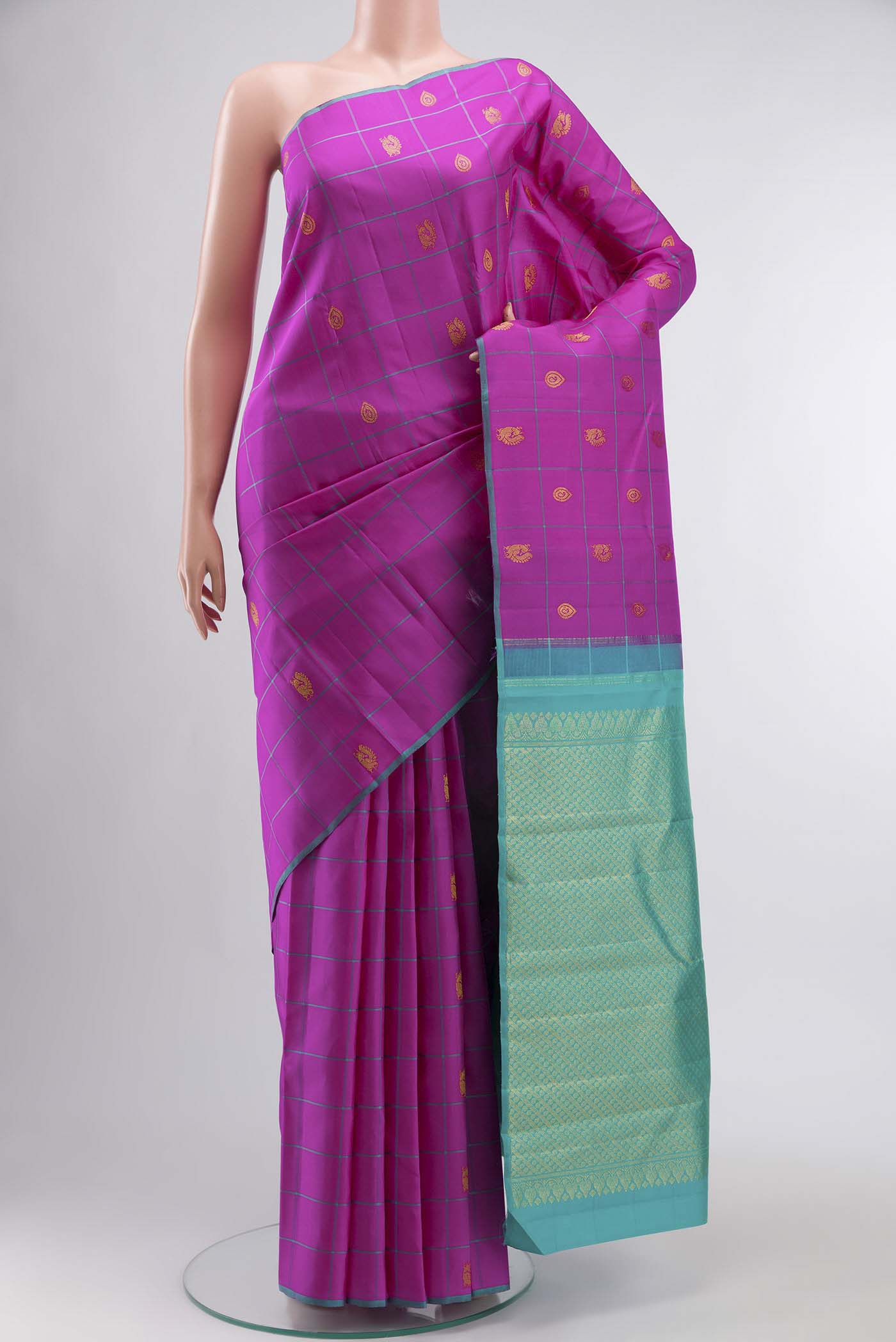 Pink Kanchipuram Silk Saree with Zari Butta on the body and Plain Border displayed on a mannequin
