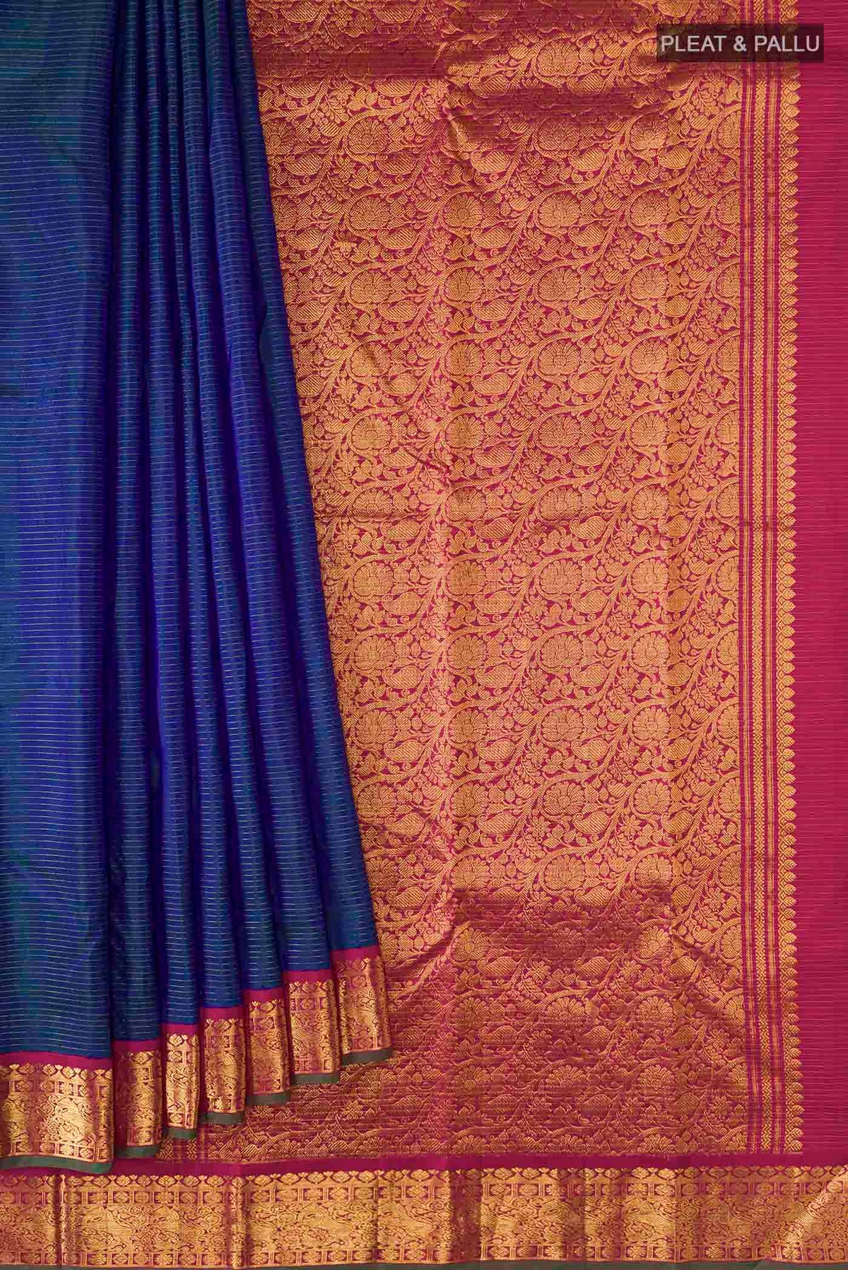 Pleats and pallu of Blue Kanchipuram Silk Saree with Stripes on the body and Zari Border