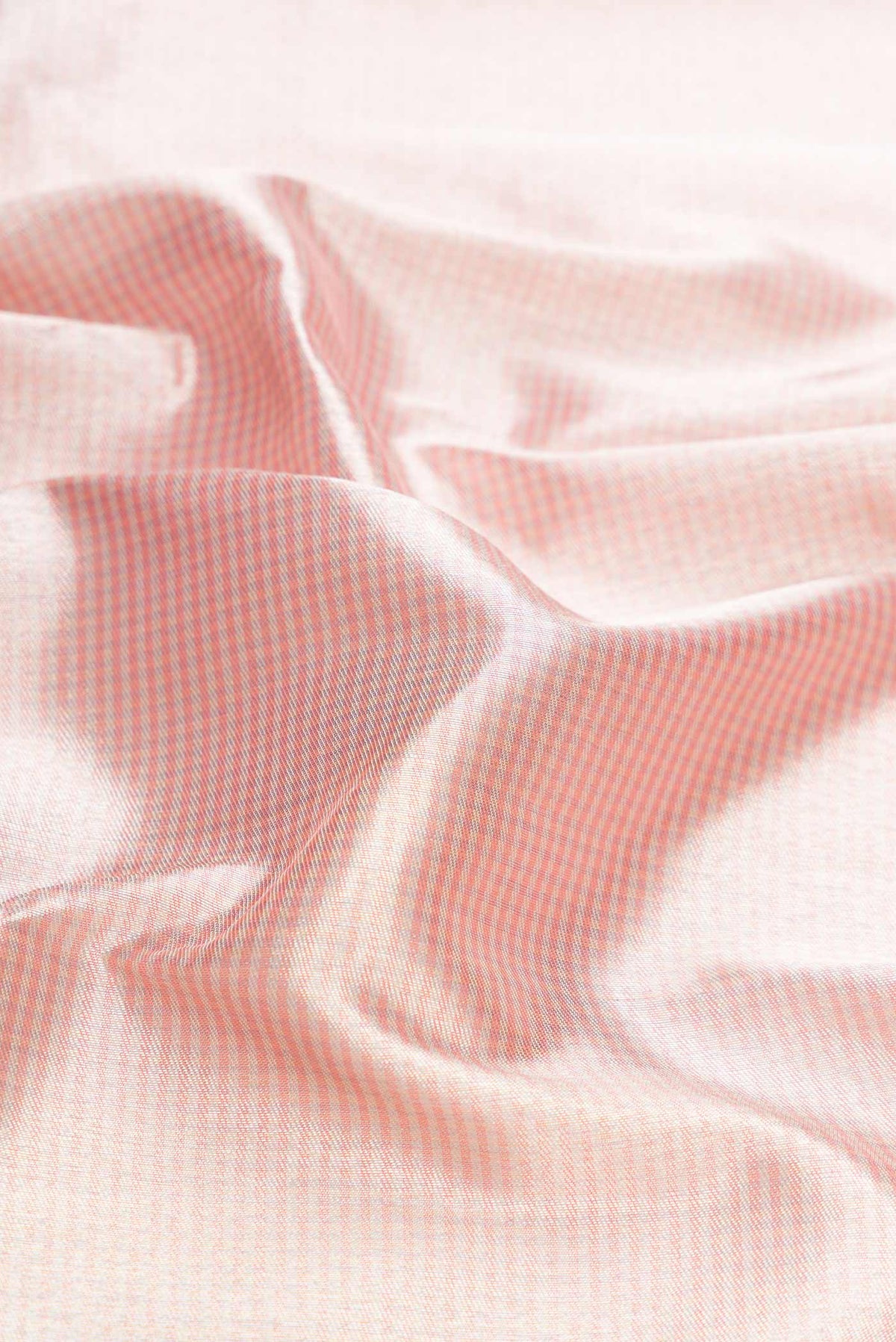 Close up of Pink Dual Tone Kanchipuram Silk Saree with Zari Brocade on the body and Zari Border displaying folds