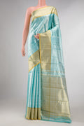 Sky Blue Dual Tone Kanchipuram Tissue Silk Saree with Stripes on the body and Zari Border displayed on a mannequin