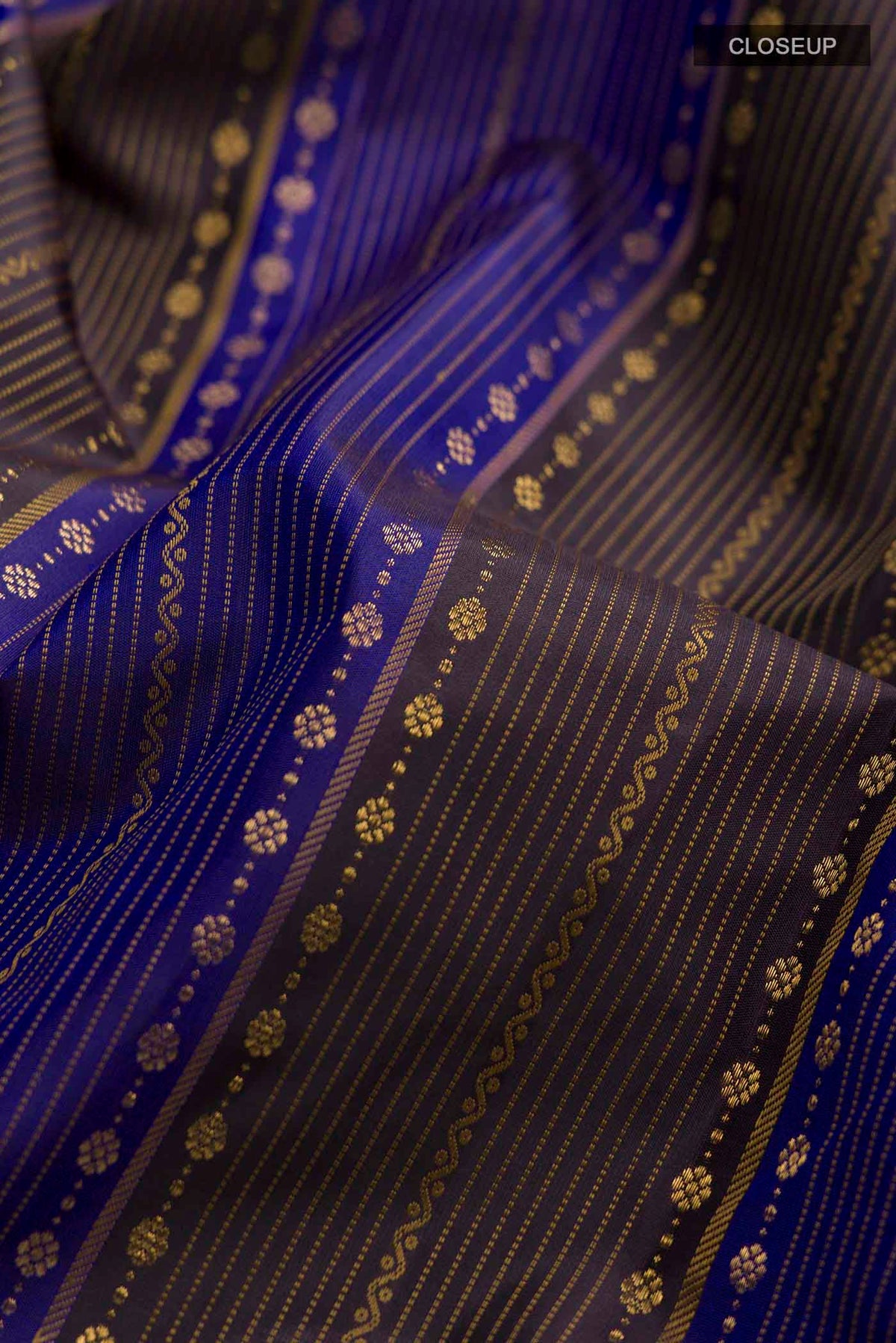 Close up of Multi Color Kanchipuram Silk Saree with Stripes on the body and Without Border displaying folds