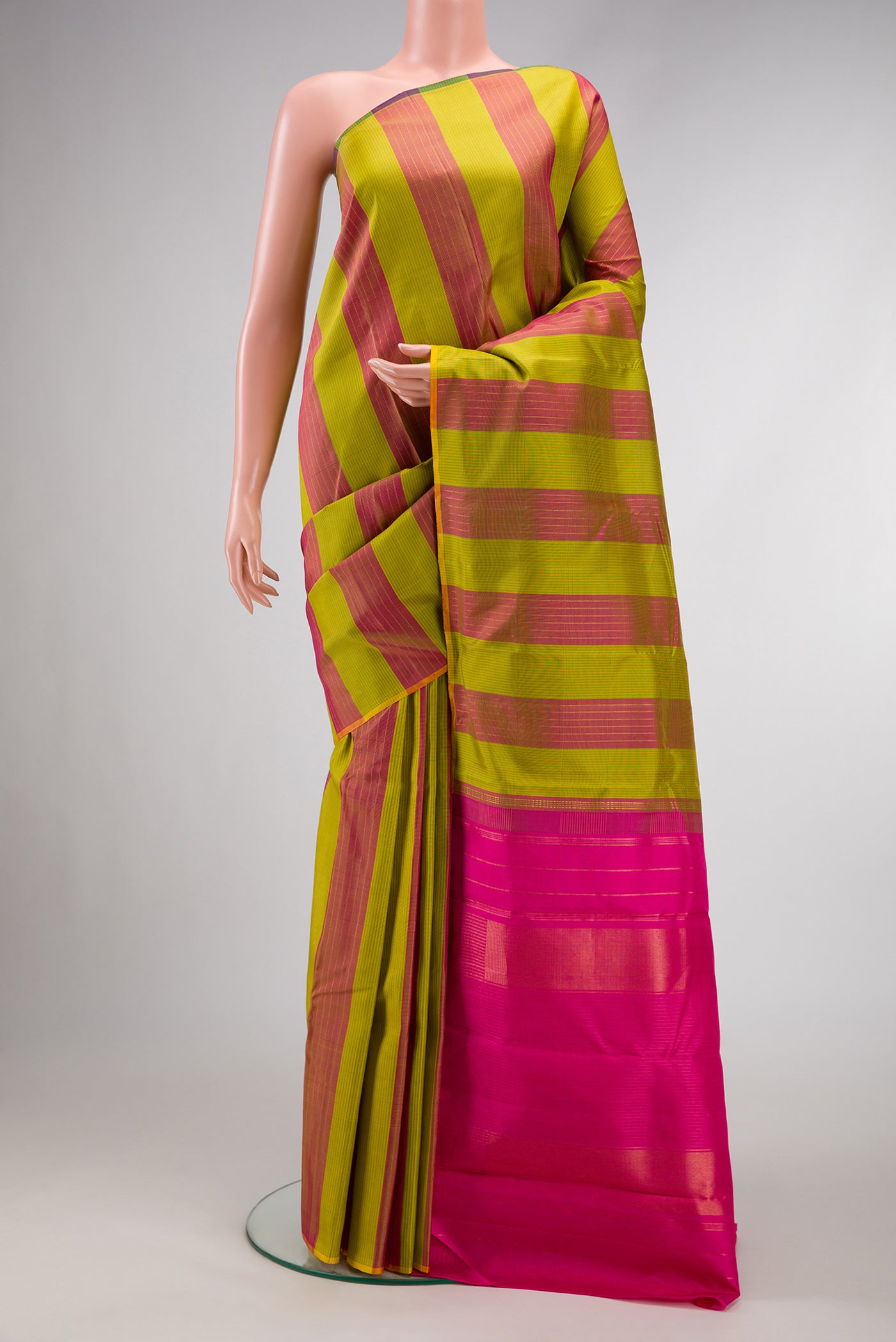 Parrot Green Dual Tone Kanjivaram Silk Saree with Stripes on the body and Without Border.  displayed on a mannequin