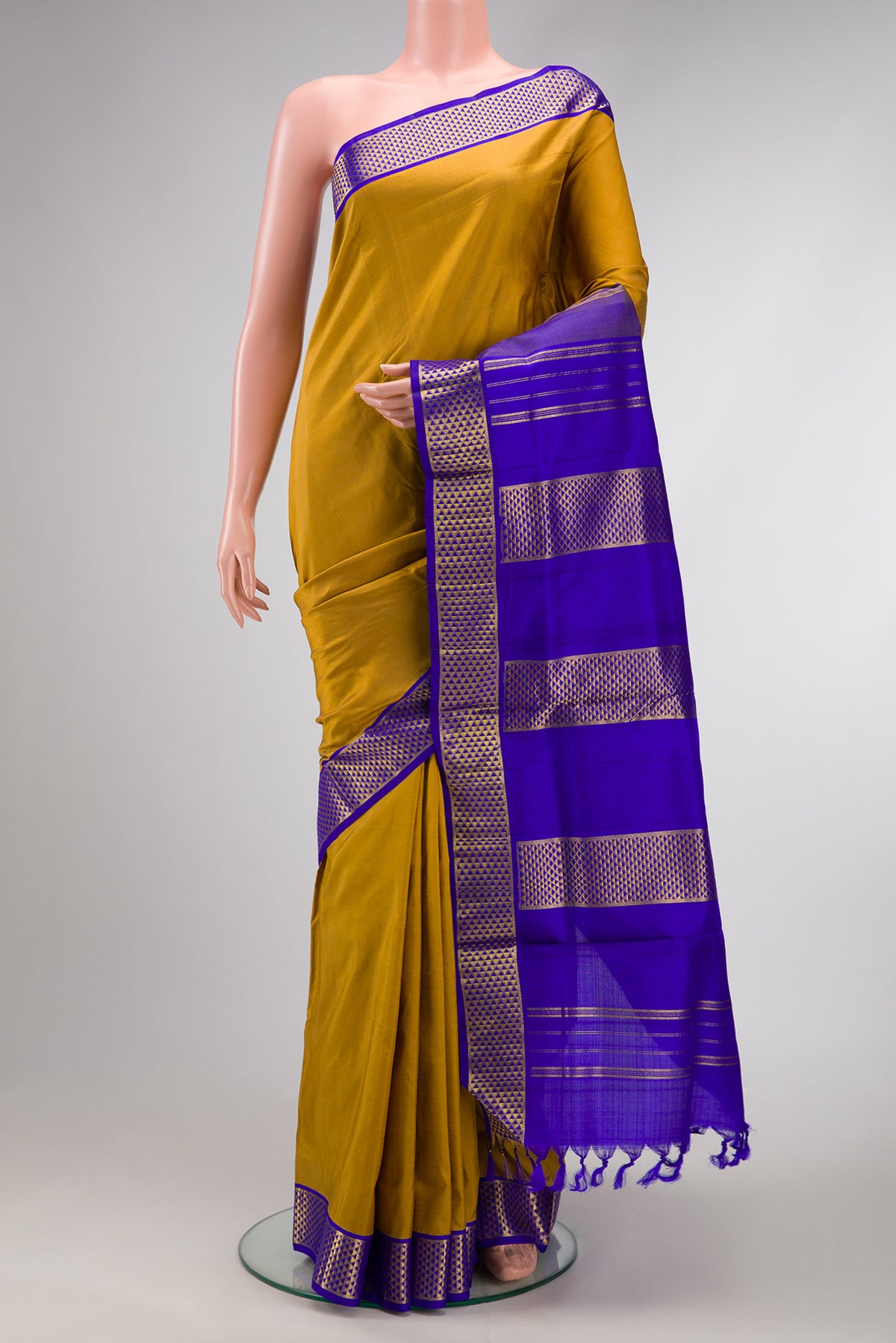 Mehandi Green Dual Tone Kanjivaram Silk Nine Yards Saree with Plain Body and Zari Border.  displayed on a mannequin