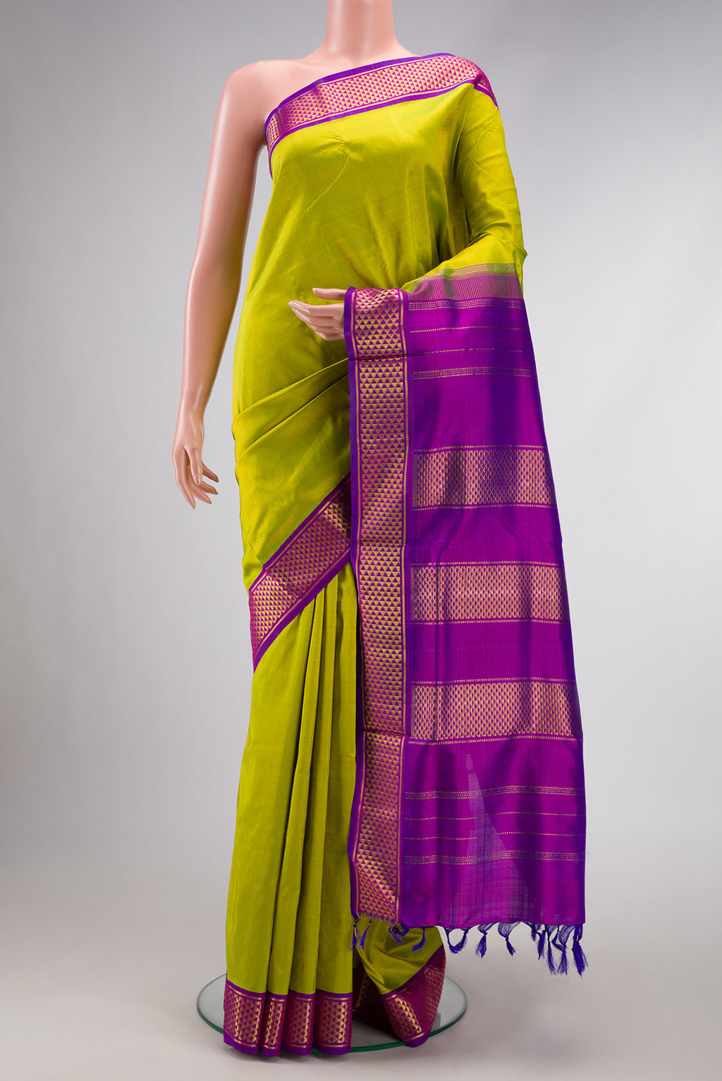 Pure Silk Pure Zari Parrot Green Dual Tone Kanjivaram Nine Yards Saree with Plain Body and Zari Border.  displayed on a mannequin