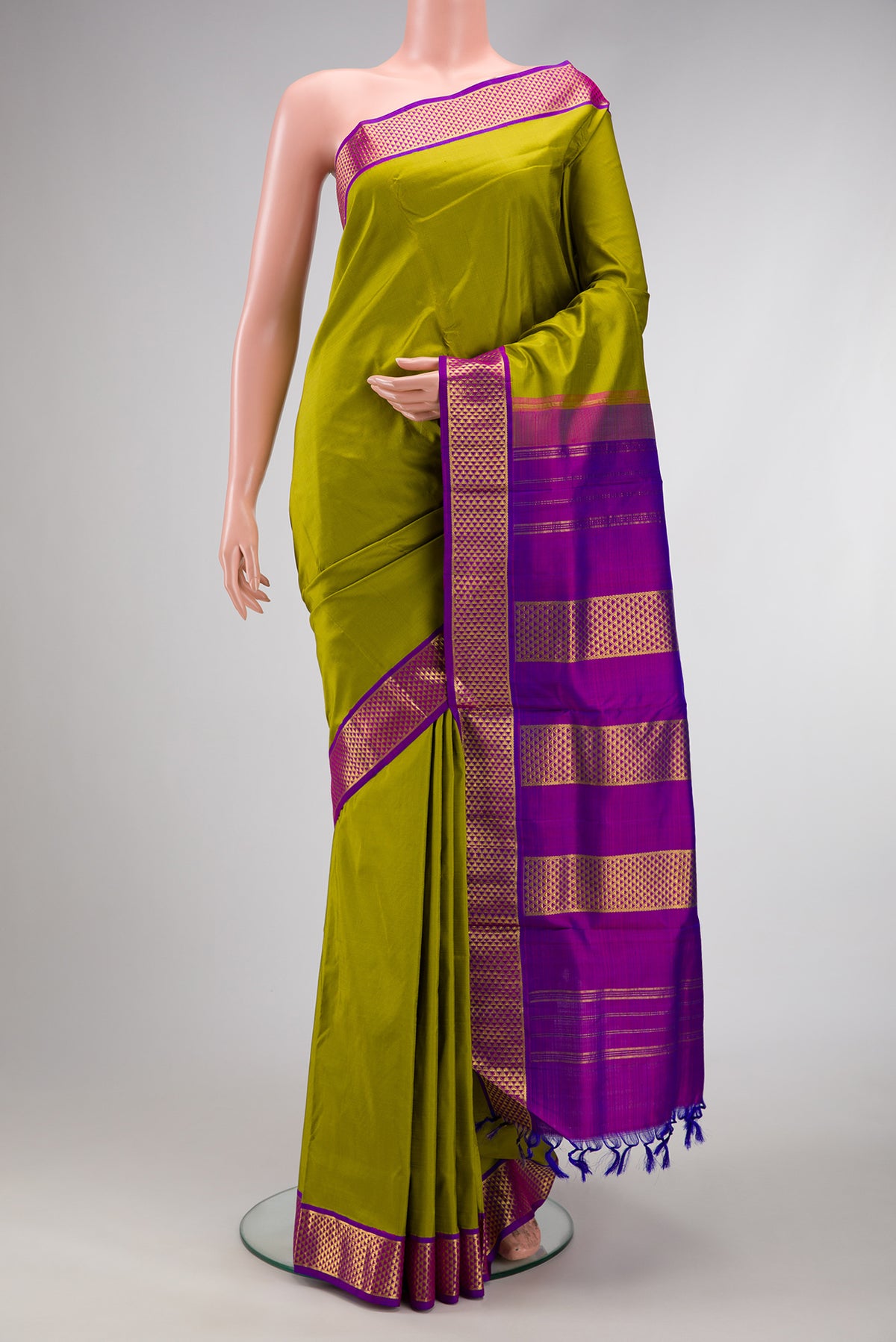 Parrot Green Dual Tone Kanjivaram Silk Nine Yards Saree with Plain Body and Zari Border.  displayed on a mannequin
