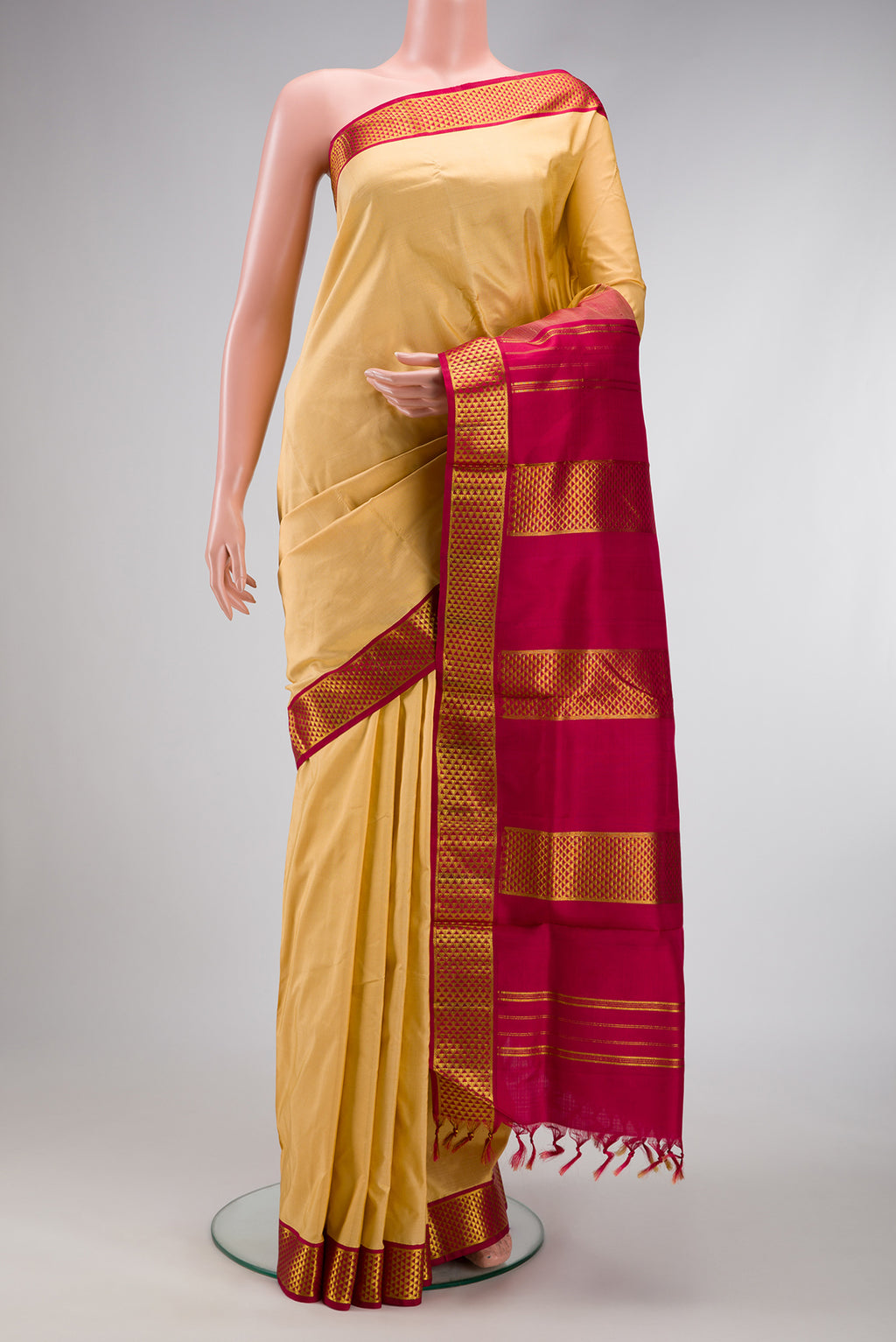 Sandal Dual Tone Kanjivaram Silk Nine Yards Saree with Stripes on the body and Zari Border.  displayed on a mannequin