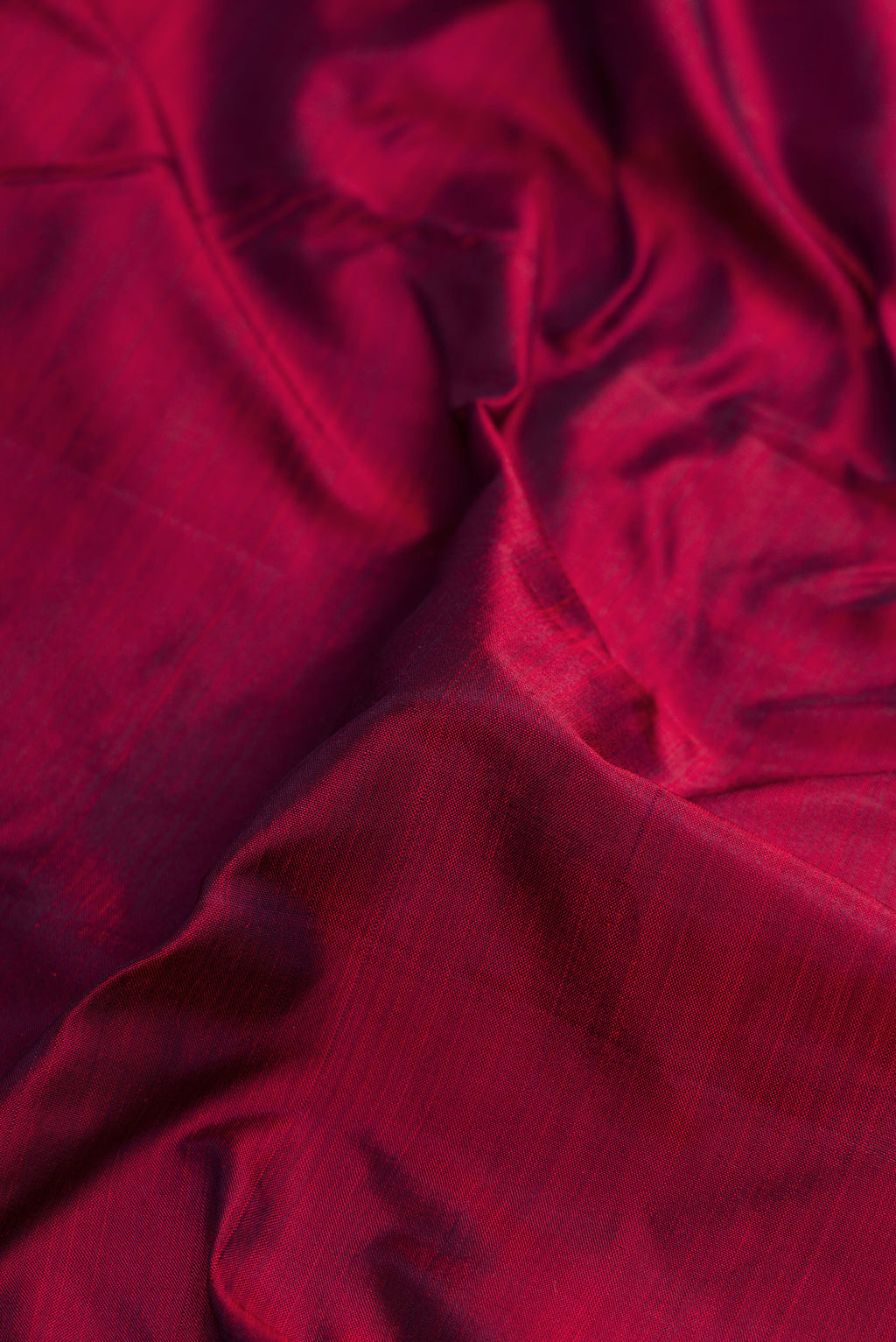 Close up of Pure Silk Pure Zari Maroon Dual Tone Kanjivaram Nine Yards Saree with Plain Body and Zari Border.  displaying folds