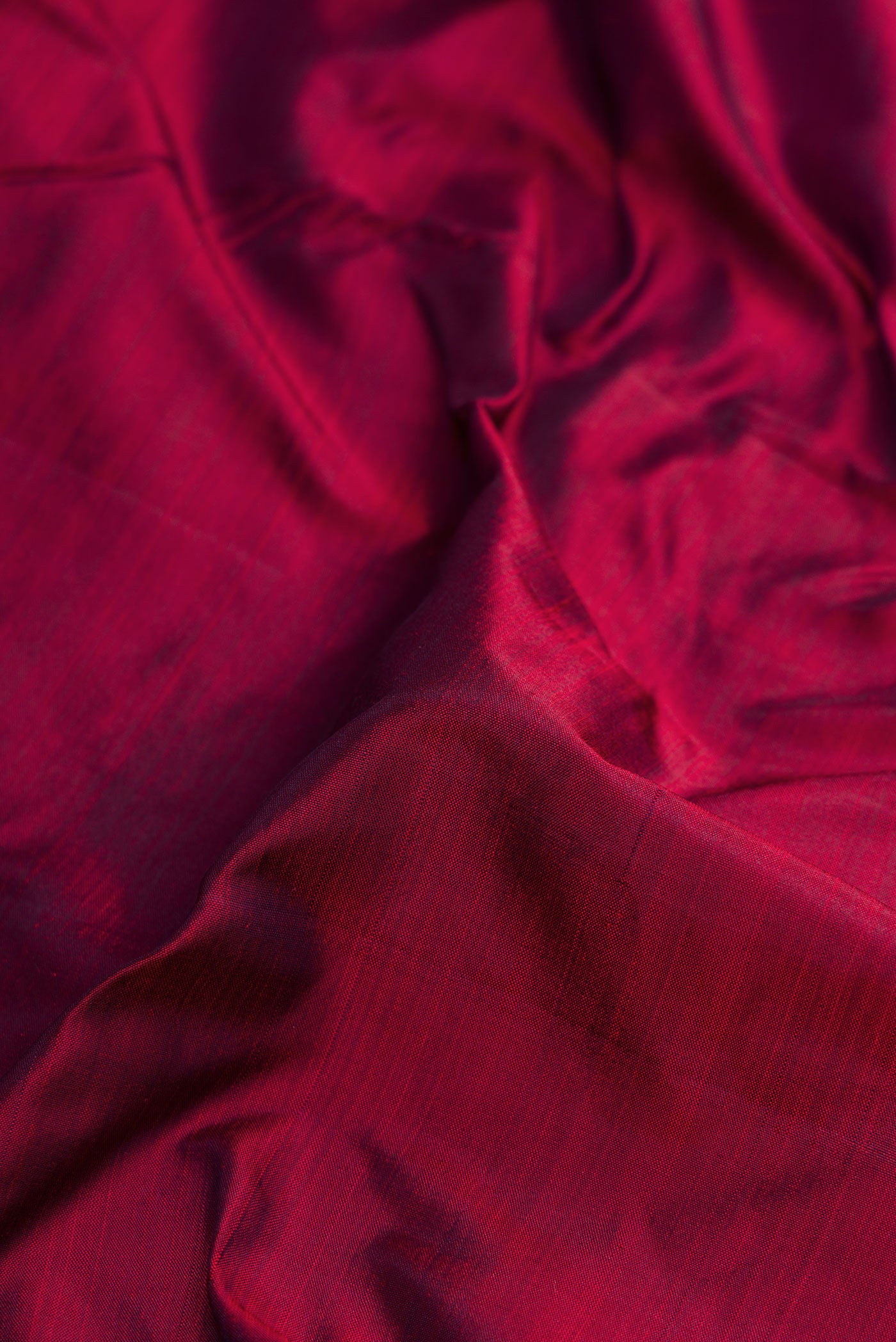 Close up of Pure Silk Pure Zari Maroon Dual Tone Kanjivaram Nine Yards Saree with Plain Body and Zari Border.  displaying folds