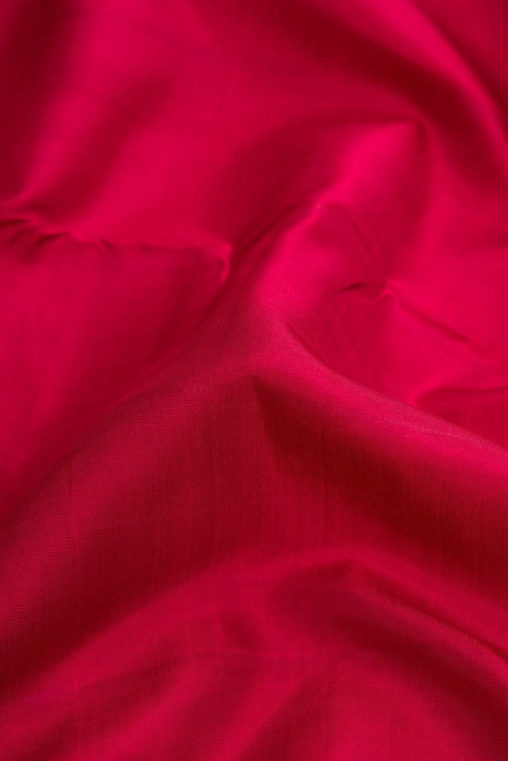 Close up of Maroon Dual Tone Kanjivaram Silk Nine Yards Saree with Plain Body and Zari Border.  displaying folds