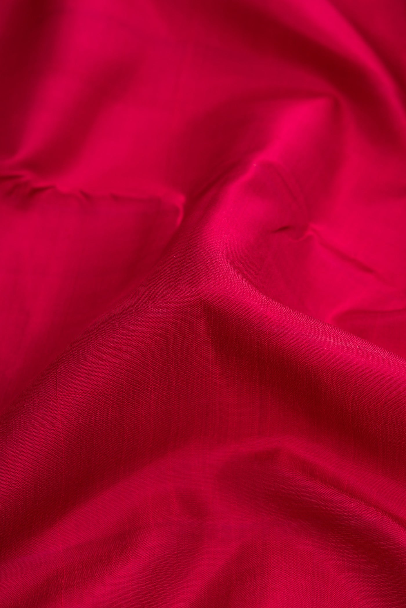 Close up of Maroon Dual Tone Kanjivaram Silk Nine Yards Saree with Plain Body and Zari Border.  displaying folds