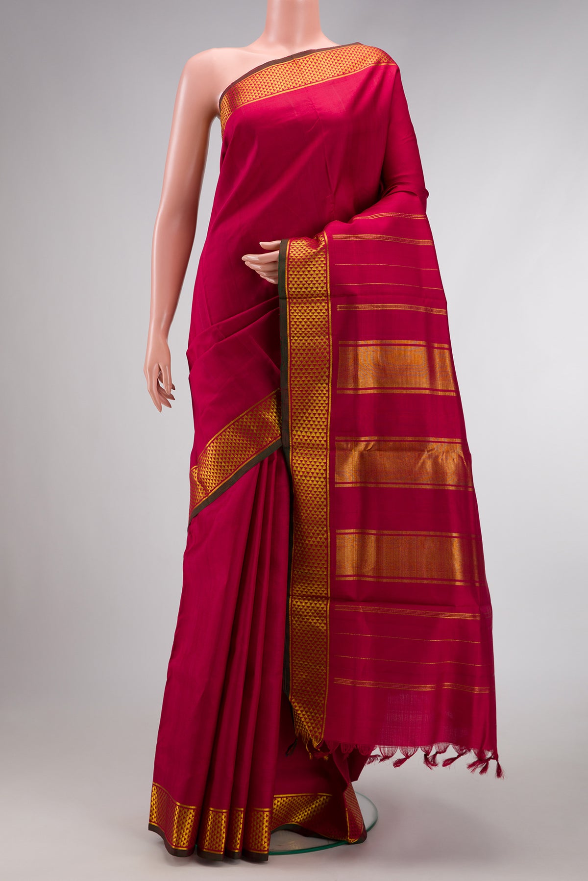 Maroon Dual Tone Kanjivaram Silk Nine Yards Saree with Plain Body and Zari Border.  displayed on a mannequin