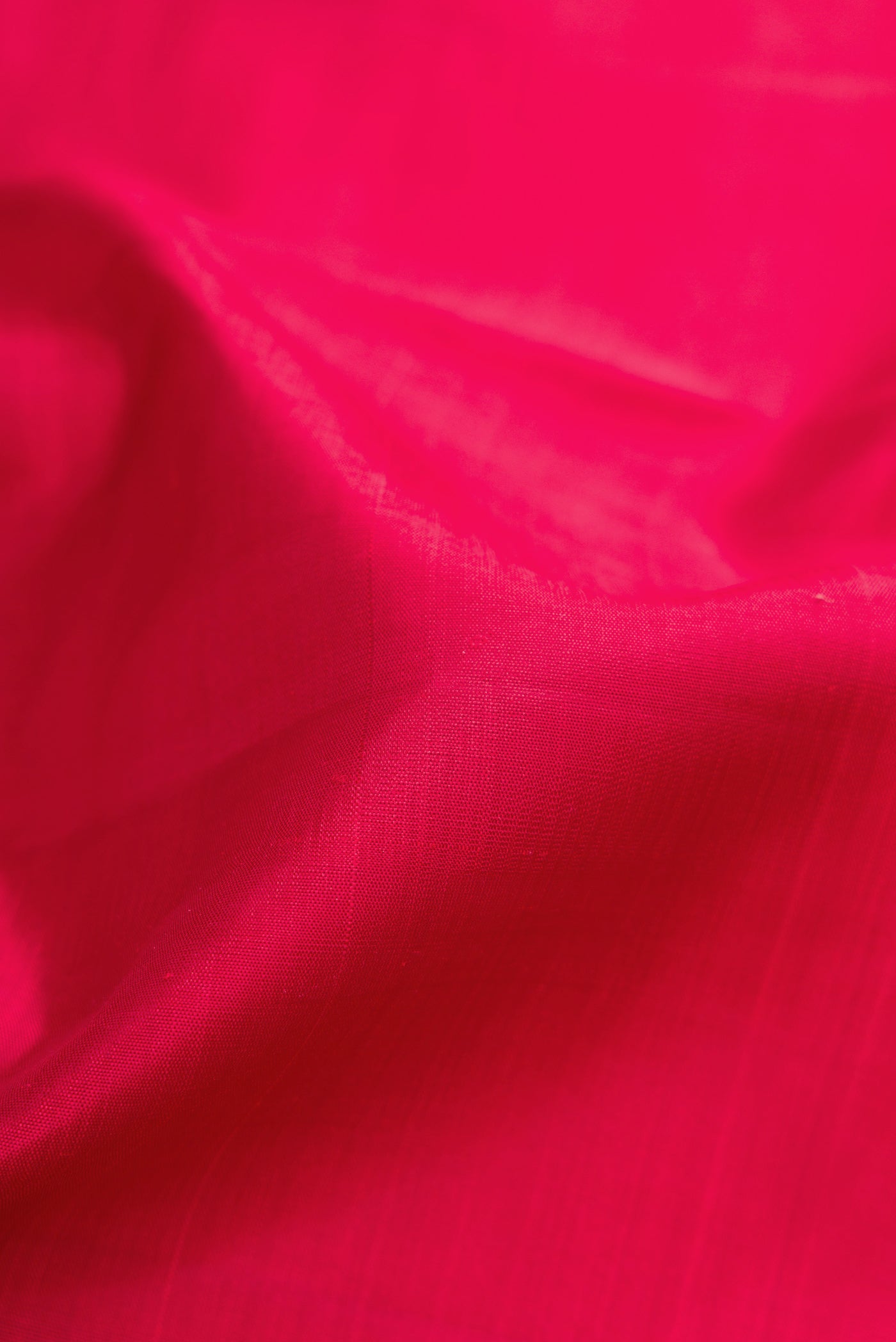 Close up of Maroon Kanjivaram Silk Nine Yards Saree with Plain Body and Zari Border.  displaying folds