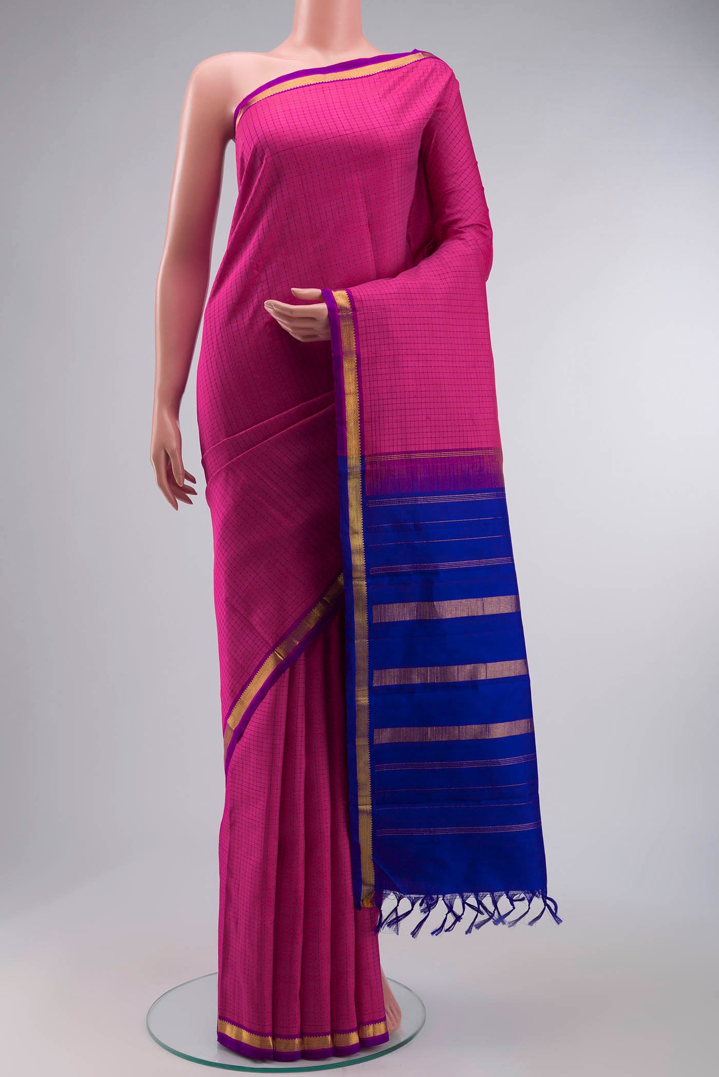 Pink Kanchipuram Silk Saree with Checked design on the body and Zari Border displayed on a mannequin