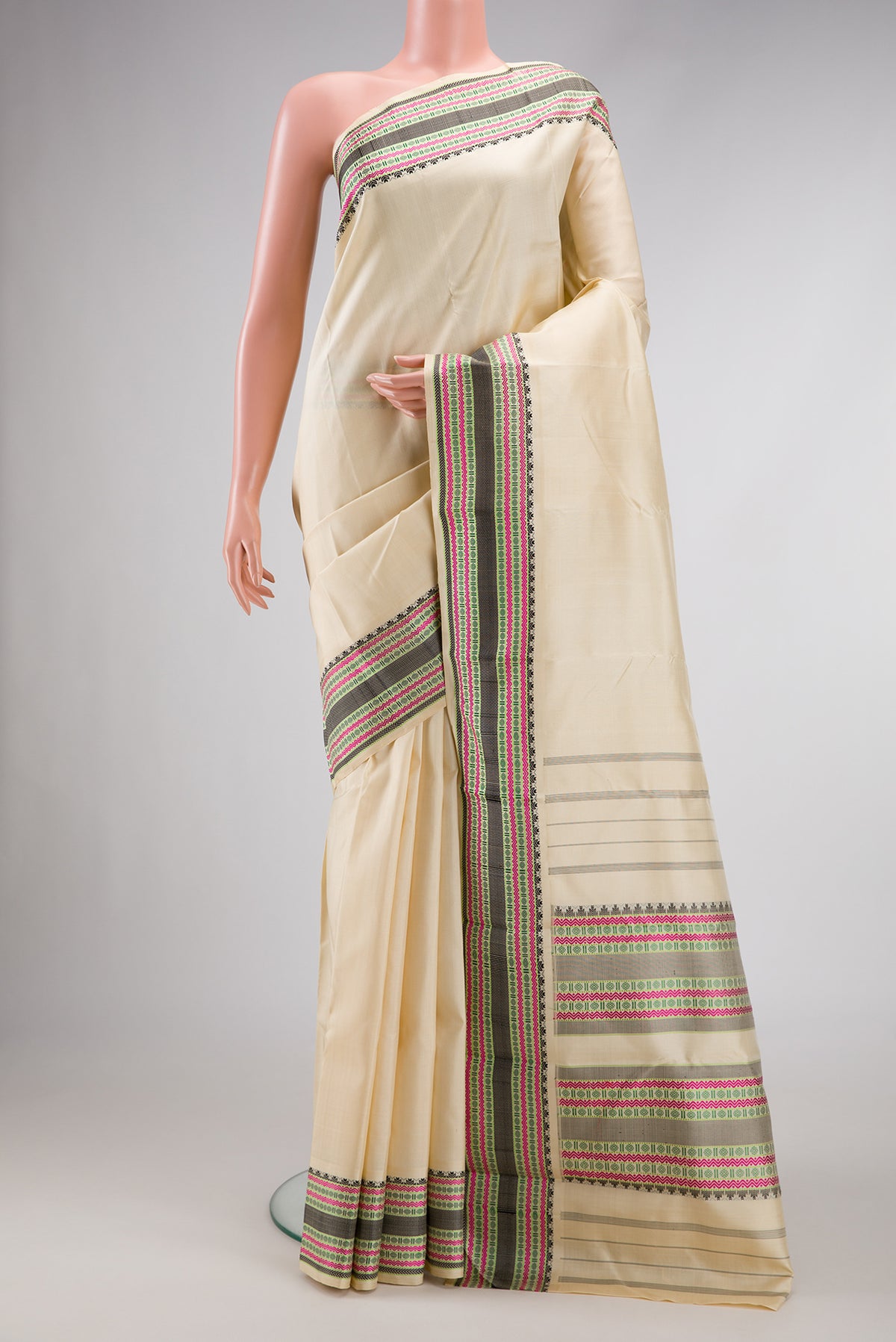 Sandal Dual Tone Kanchipuram Silk Saree with Plain Body and Thread Border.  displayed on a mannequin