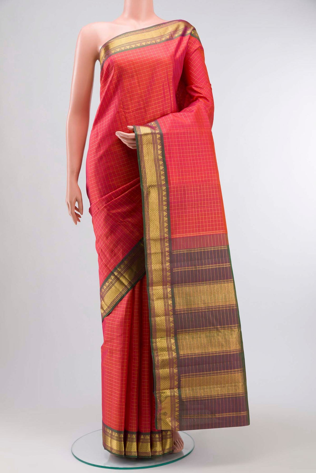 Orange with Pink Color Kanchipuram Silk Saree with Checked design on the body and Zari Border displayed on a mannequin