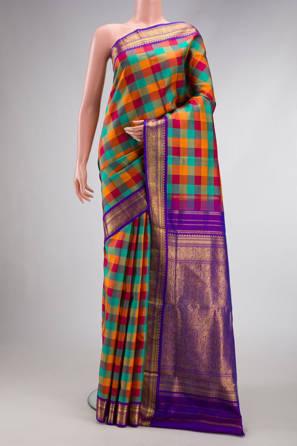 Pure Silk Pure Zari Green , Pink and Orange Color Kanchipuram Nine Yards Saree with Checked design on the body and Zari Border.  displayed on a mannequin
