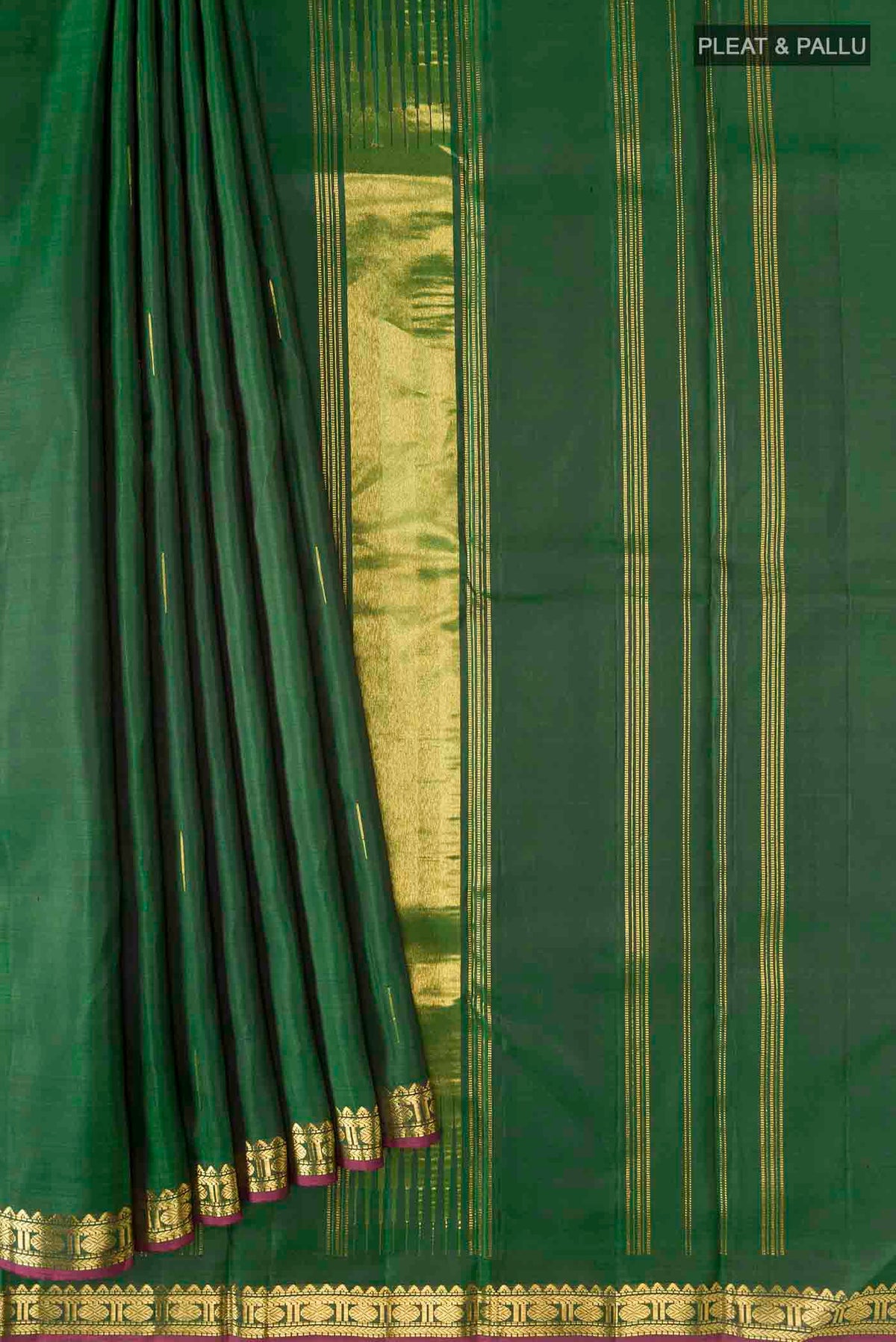 Pleats and pallu of Green Kanchipuram Silk Saree with Zari Butta on the body and Zari Border