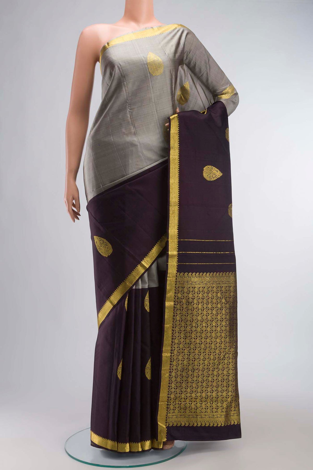 Multi Color Kanchipuram Silk Saree with Half And Half on the body and Zari Border displayed on a mannequin