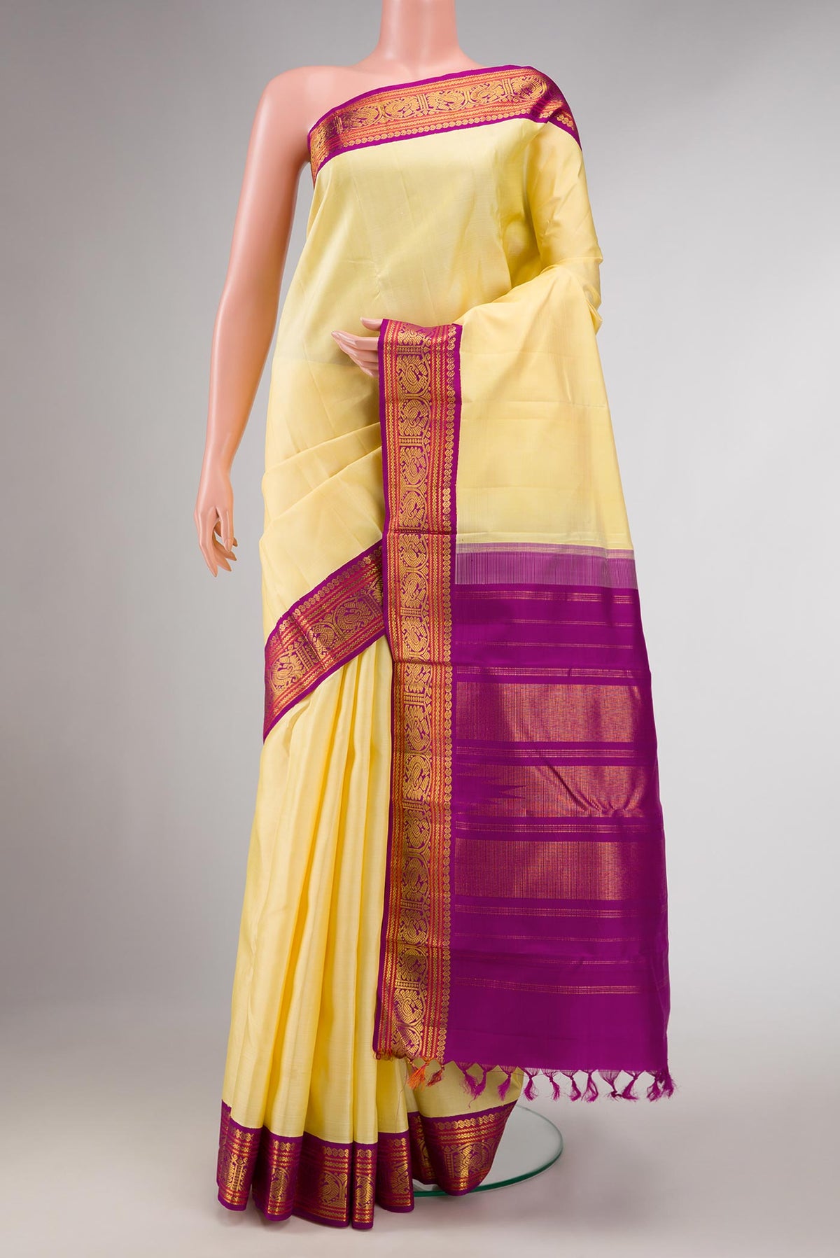 Pure Silk Pure Zari Sandal Dual Tone Kanchipuram Saree with Plain Body and Zari Border displayed on a mannequin