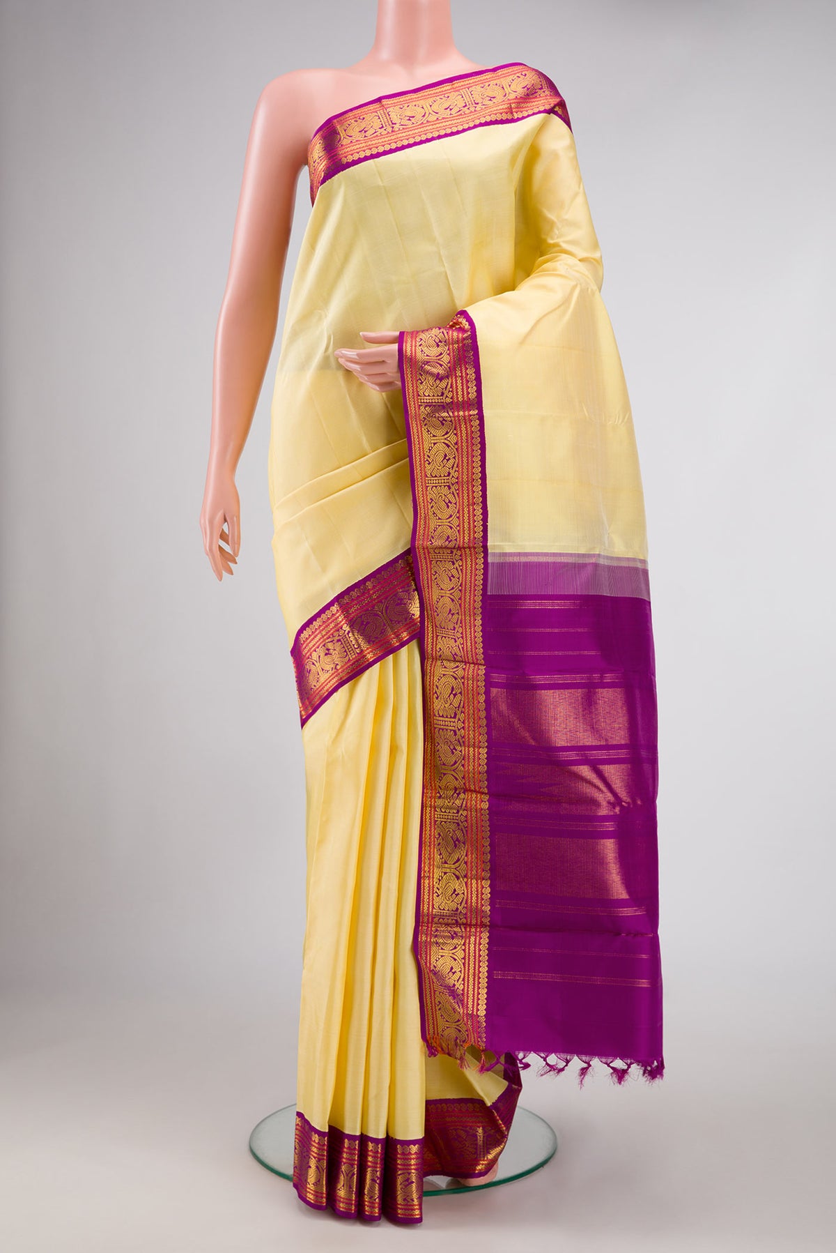 Sandal Dual Tone Kanjivaram Silk Saree with Plain Body and Zari Border.  displayed on a mannequin