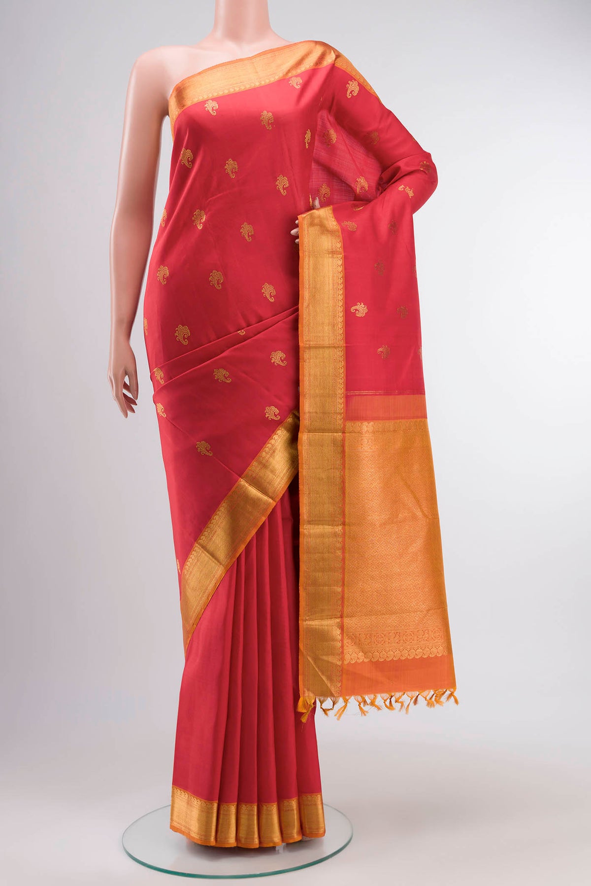 Red Kanchipuram Silk Saree with Zari Butta on the body and Zari Border displayed on a mannequin