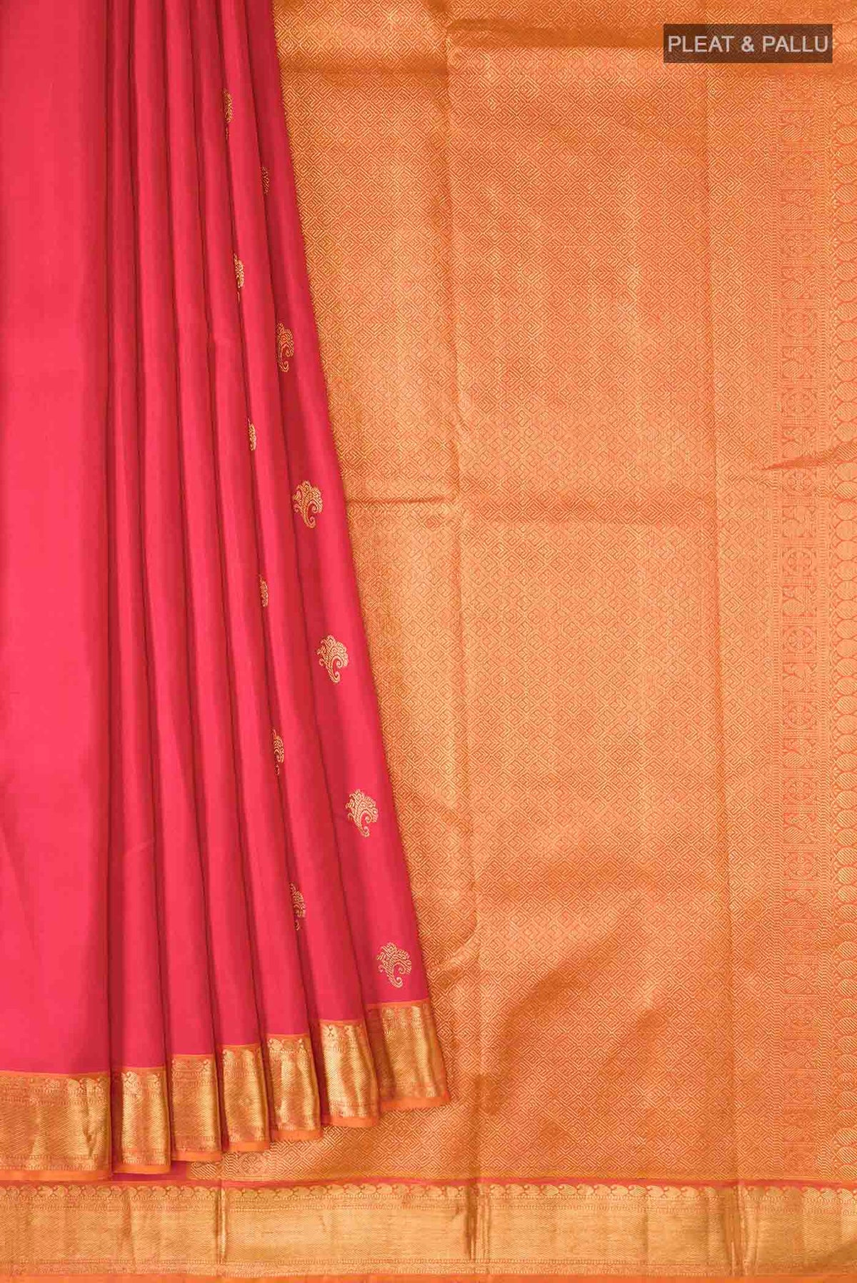 Pleats and pallu of Red Kanchipuram Silk Saree with Zari Butta on the body and Zari Border