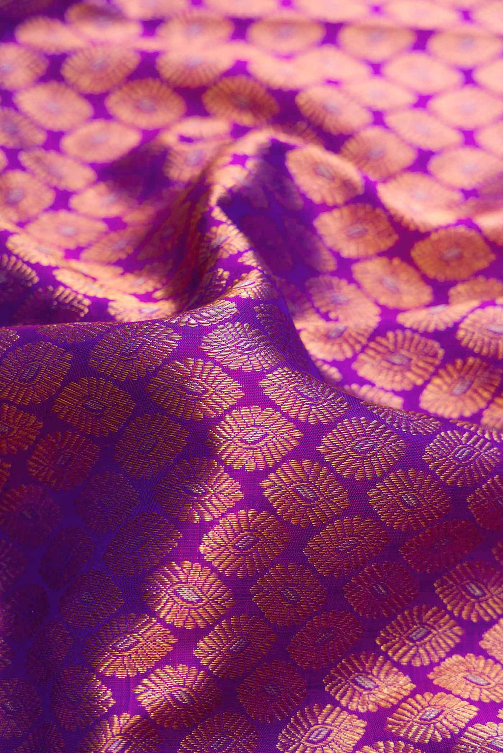 Close up of Purple Dual Tone Kanchipuram Silk Saree with Zari Brocade on the body and Zari Border.  displaying folds