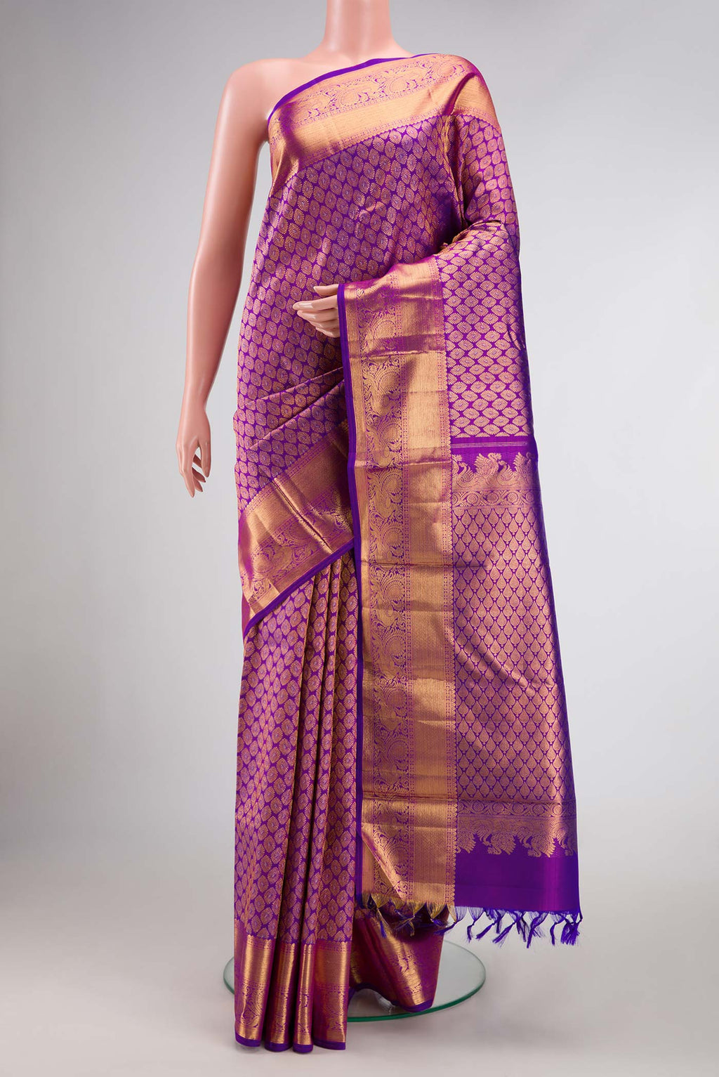 Purple Dual Tone Kanchipuram Silk Saree with Zari Brocade on the body and Zari Border.  displayed on a mannequin